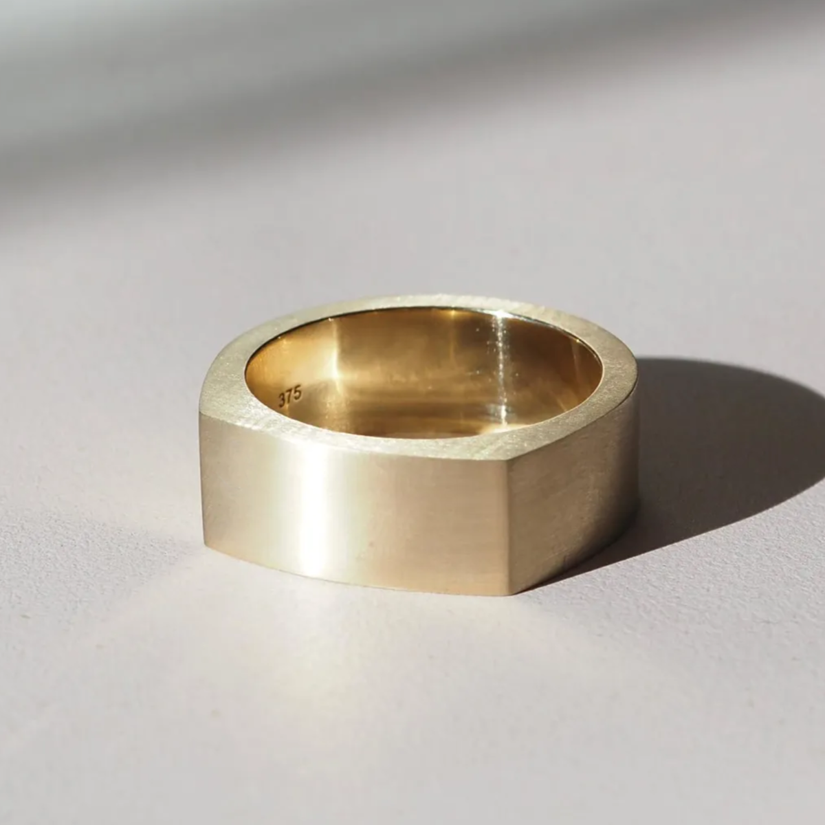 A modern flat top wedding band, designed for comfort and simplicity in 9ct yellow gold