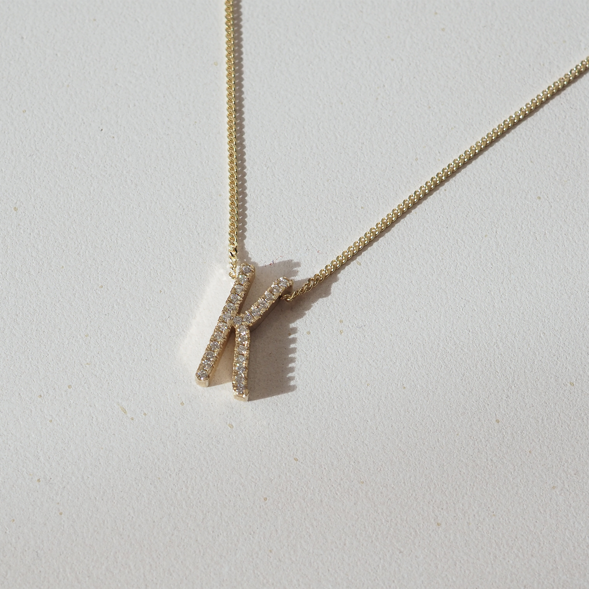 Large diamond Letter K in solid 9ct yellow gold with white lab grown diamonds