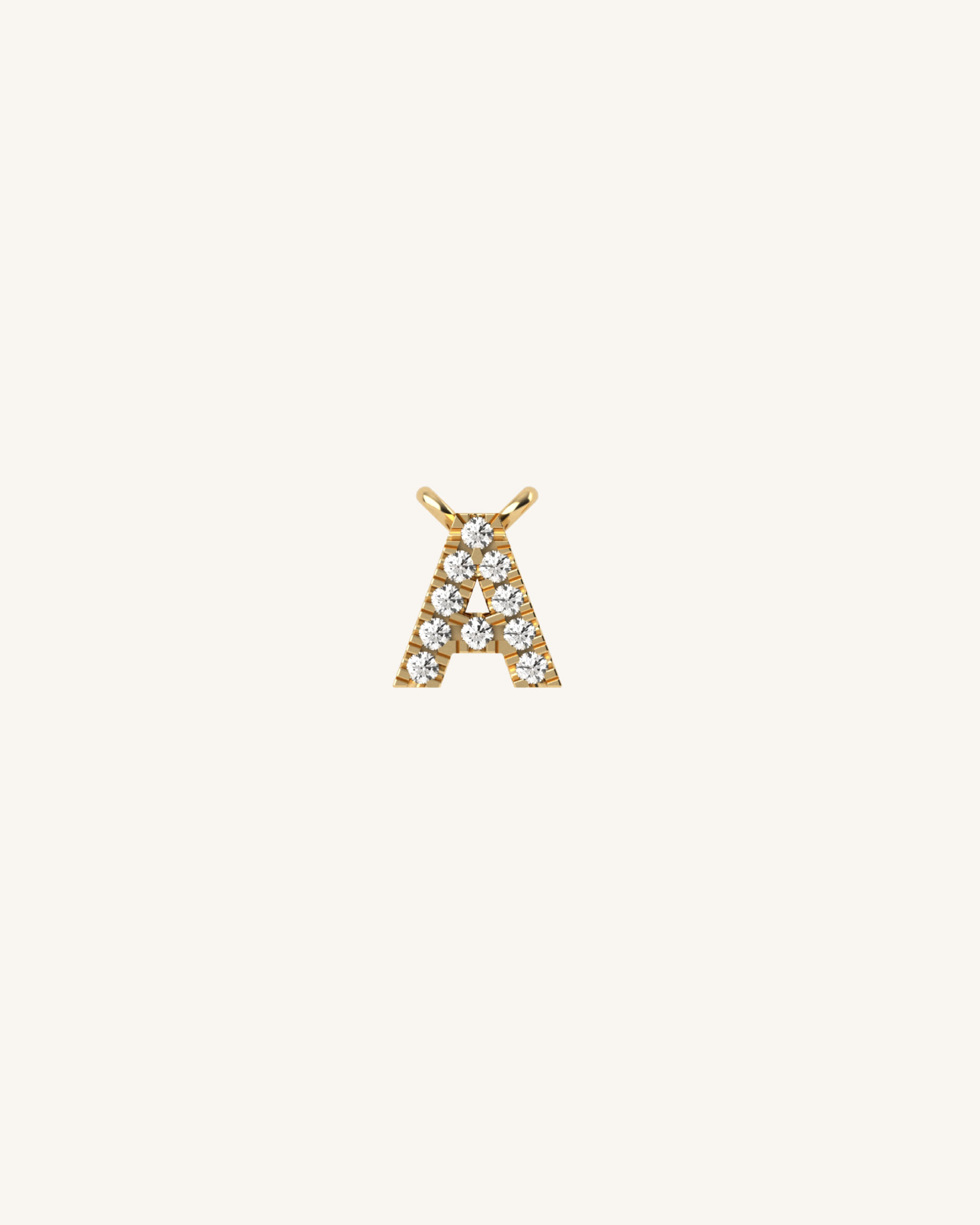 Gold letter 'A' pendant with diamonds on a white background