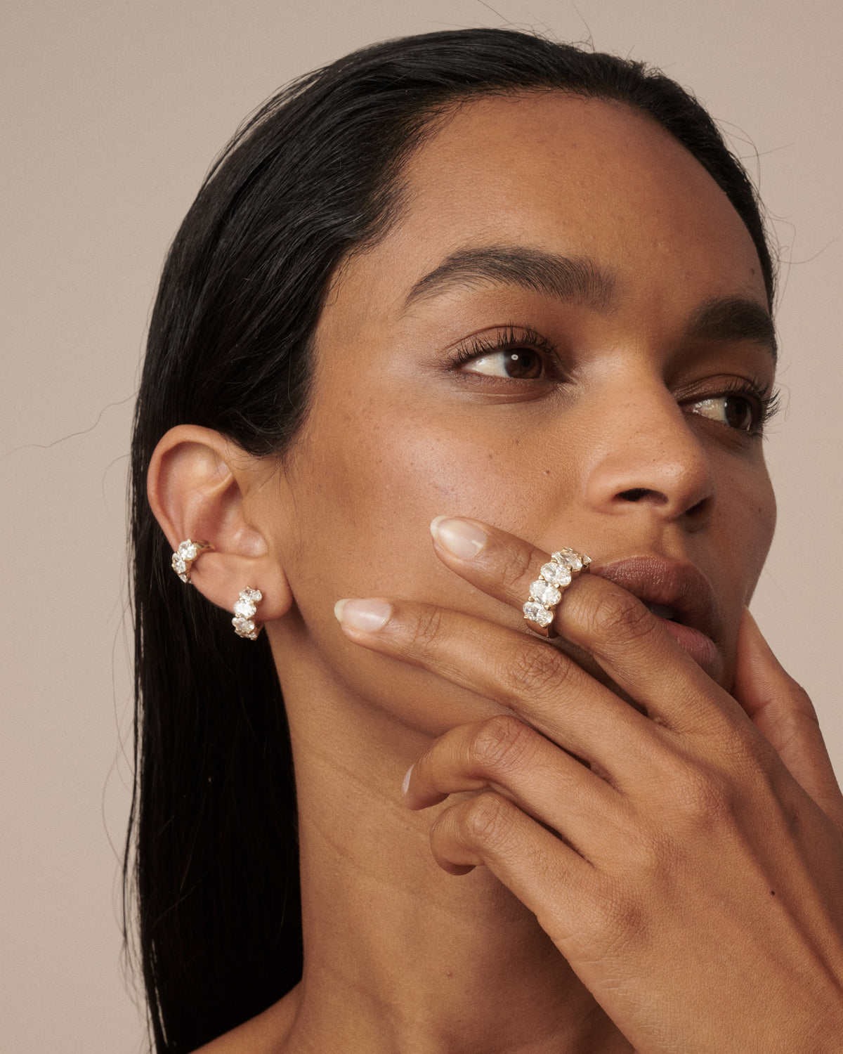 Oval lab-grown diamond hoop earrings in gold, model wearing pair