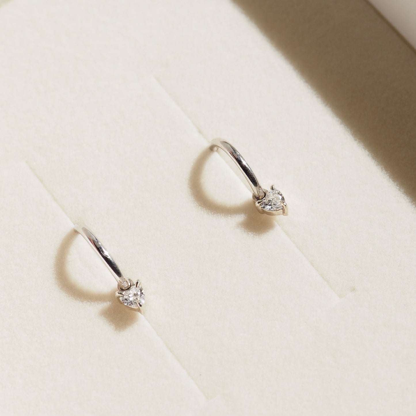 Heart charm earrings in box