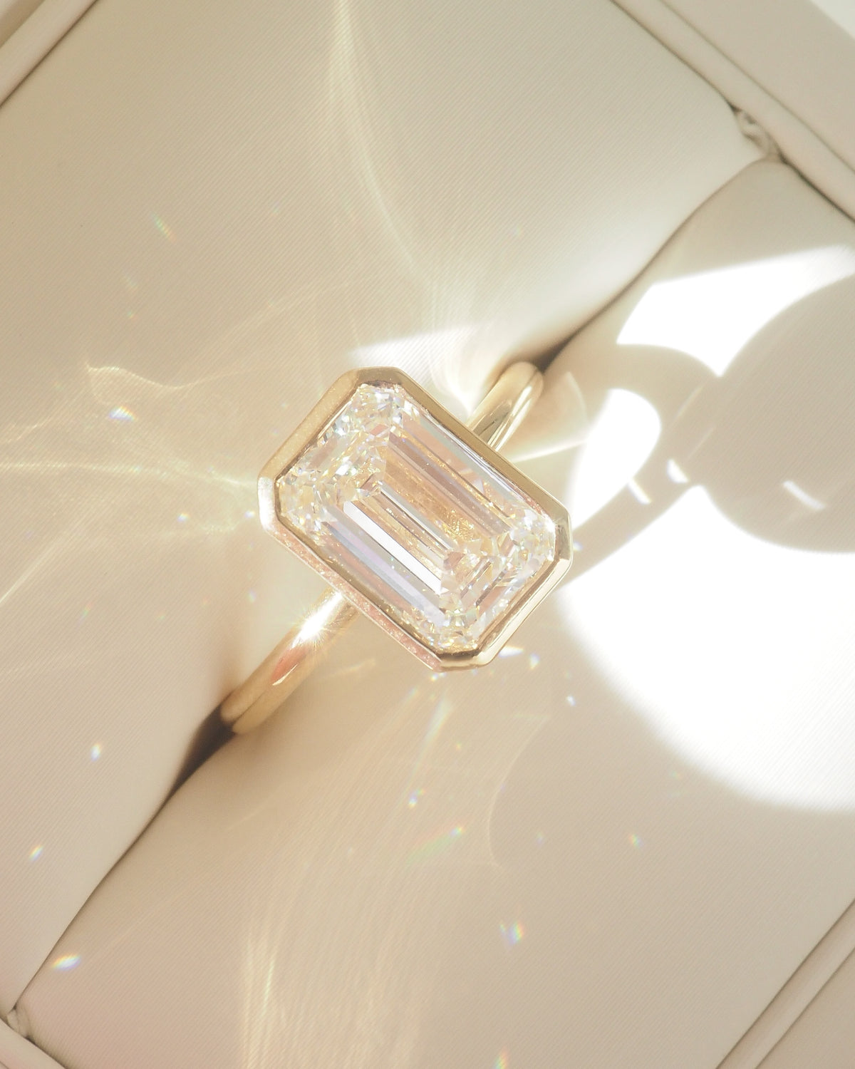 Emerald diamond ring in a cream box