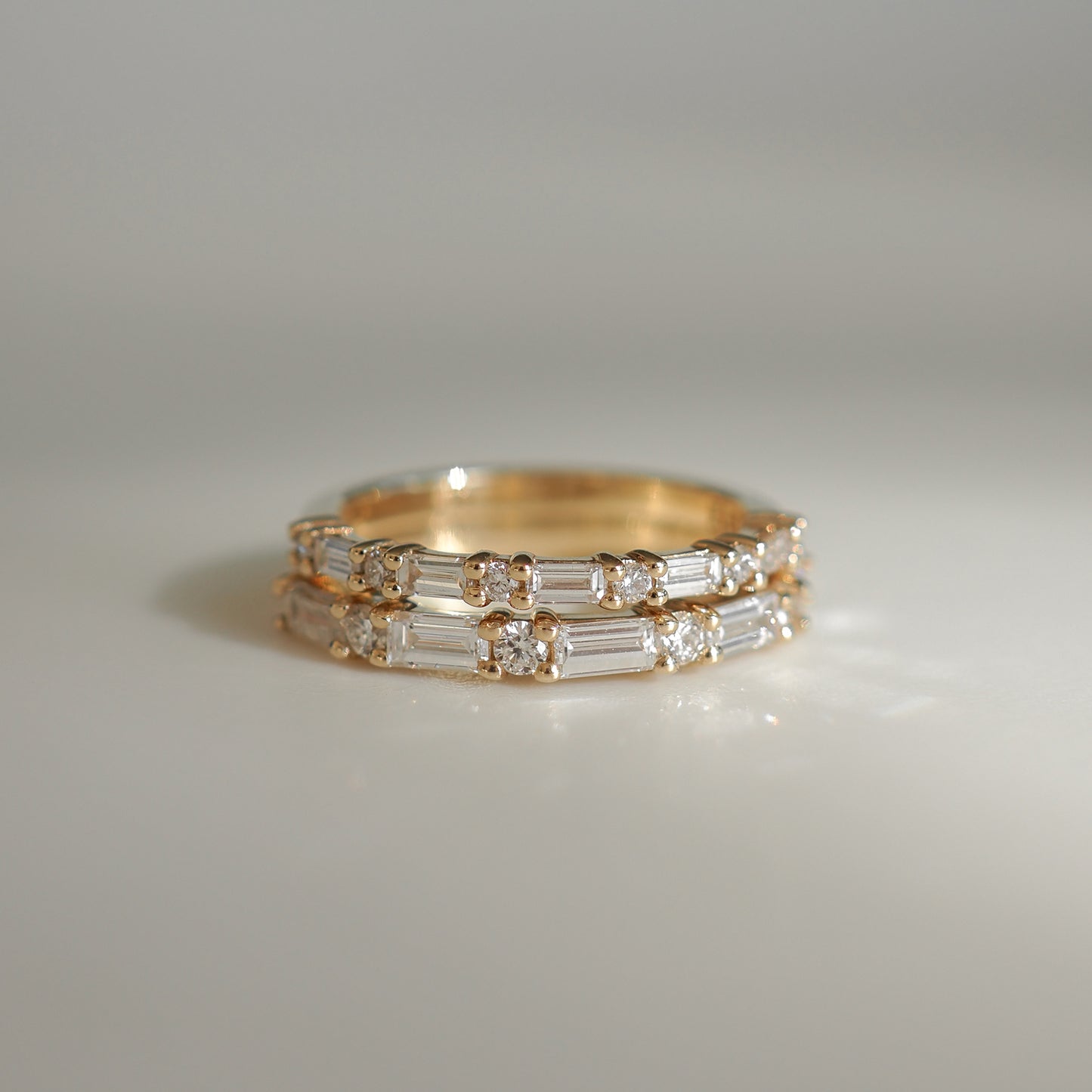 Elegant gold ring with baguette diamonds, reflecting luxury and sophistication. Ideal for upscale jewellery lovers.
