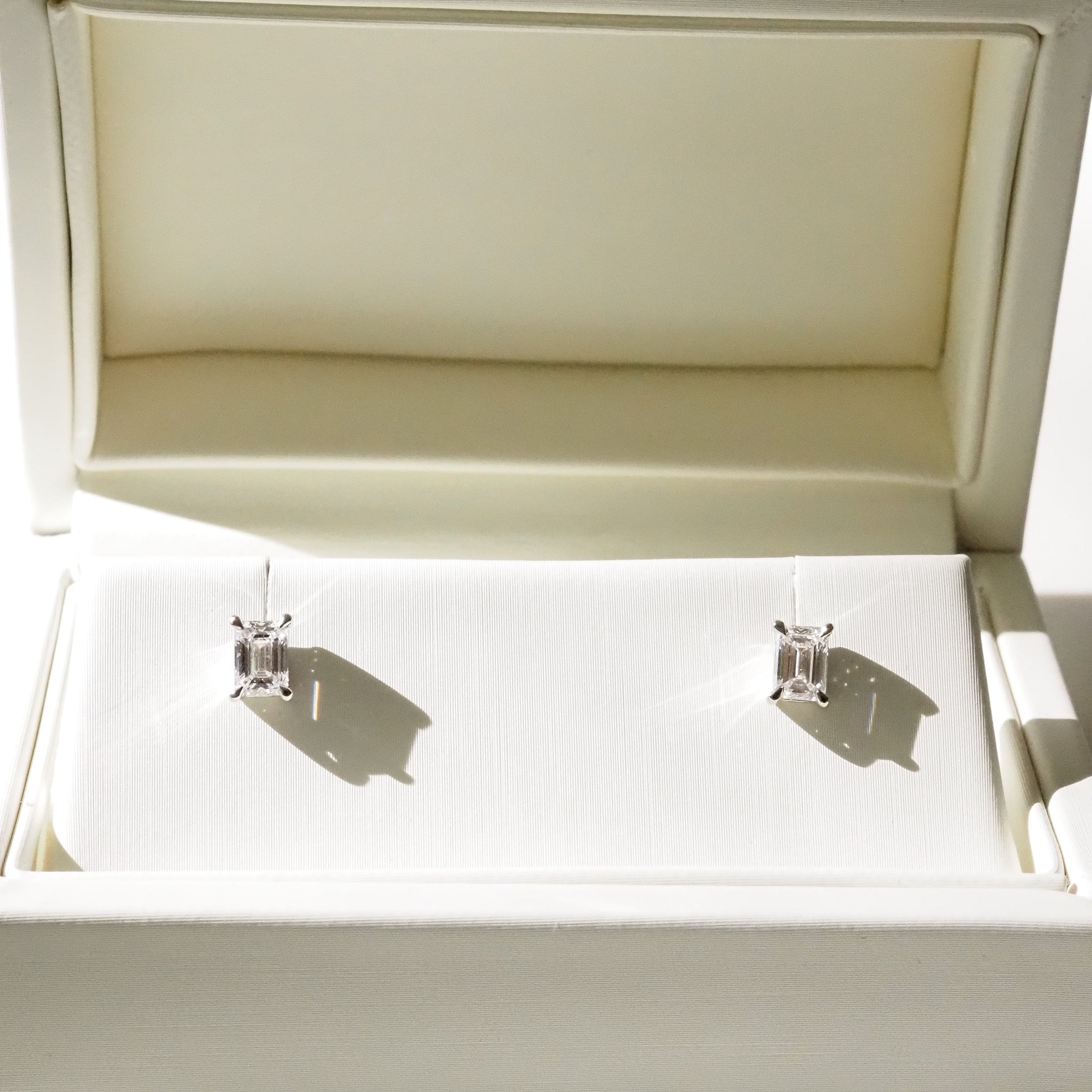 Pair of diamond earrings in an open jewelry box