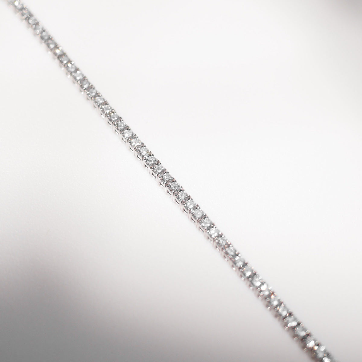 Diamond bracelet on a light gray background