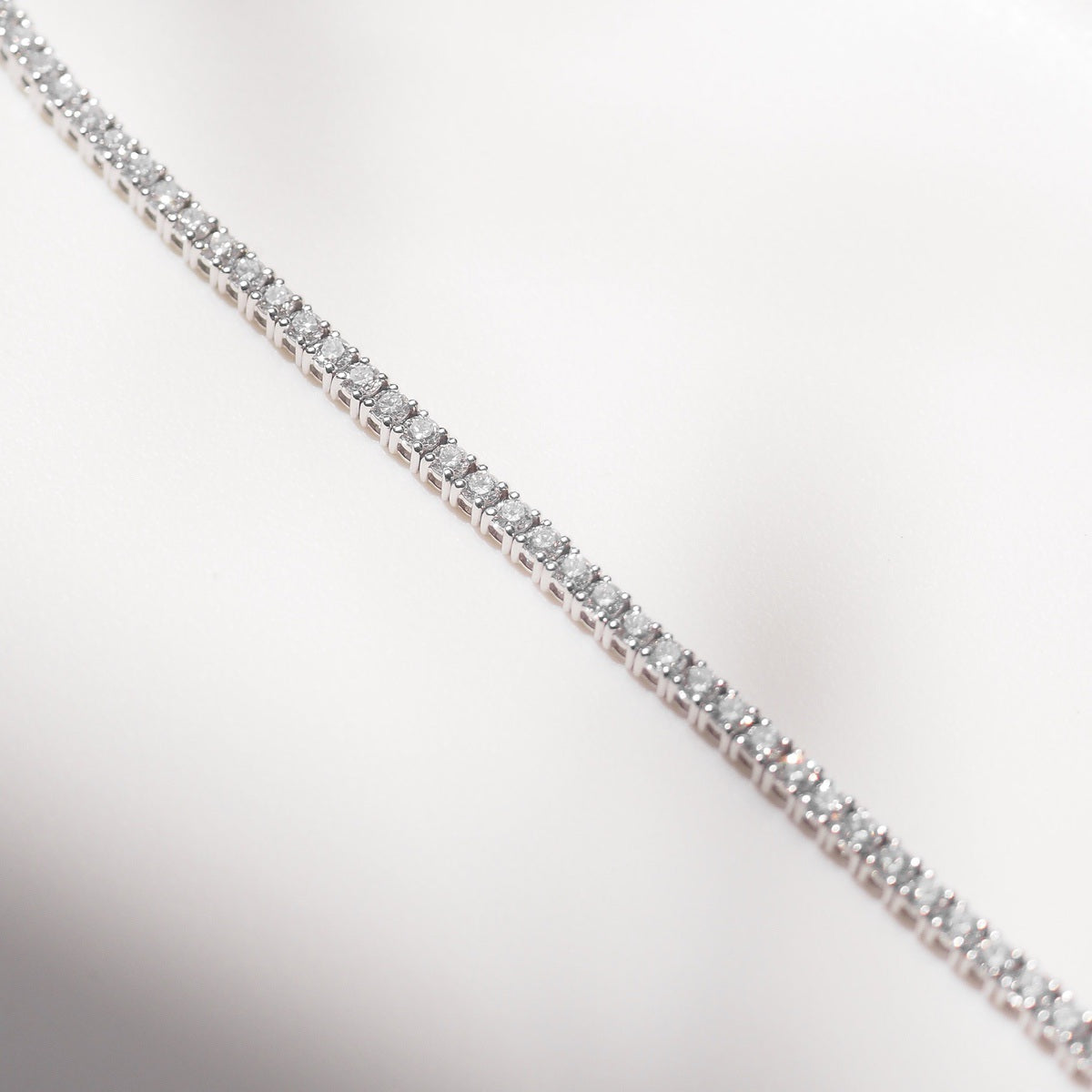 Diamond bracelet on a light gray background