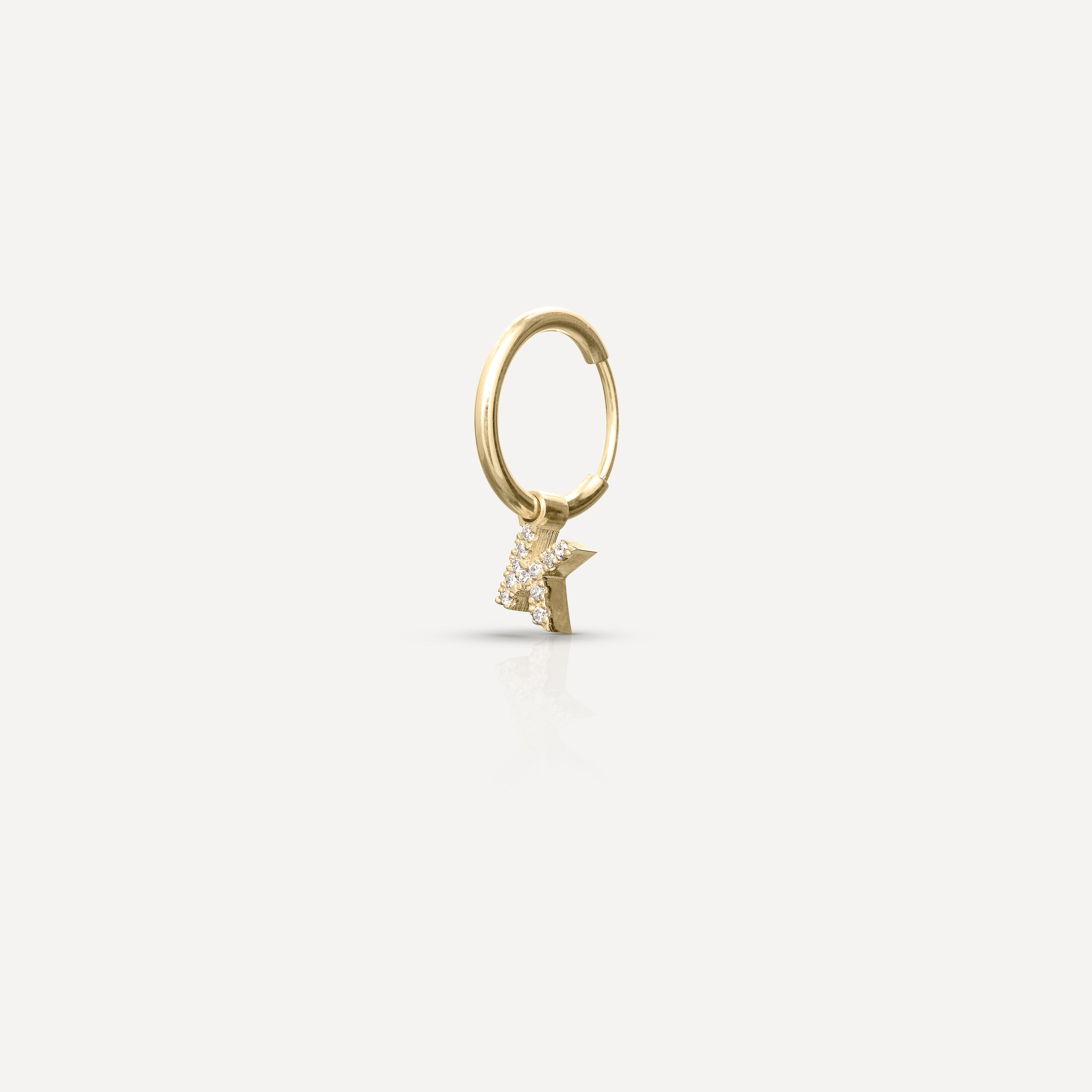 Gold hoop earring with a sparkling star-shaped charm, set against a white background; luxury jewellery design.