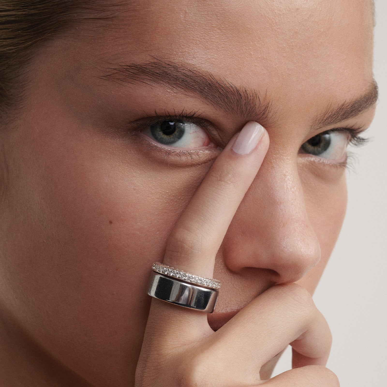 [text overlay: Our Wellness Ring (18ct White Gold, 8) stacked with the Oura Ring]