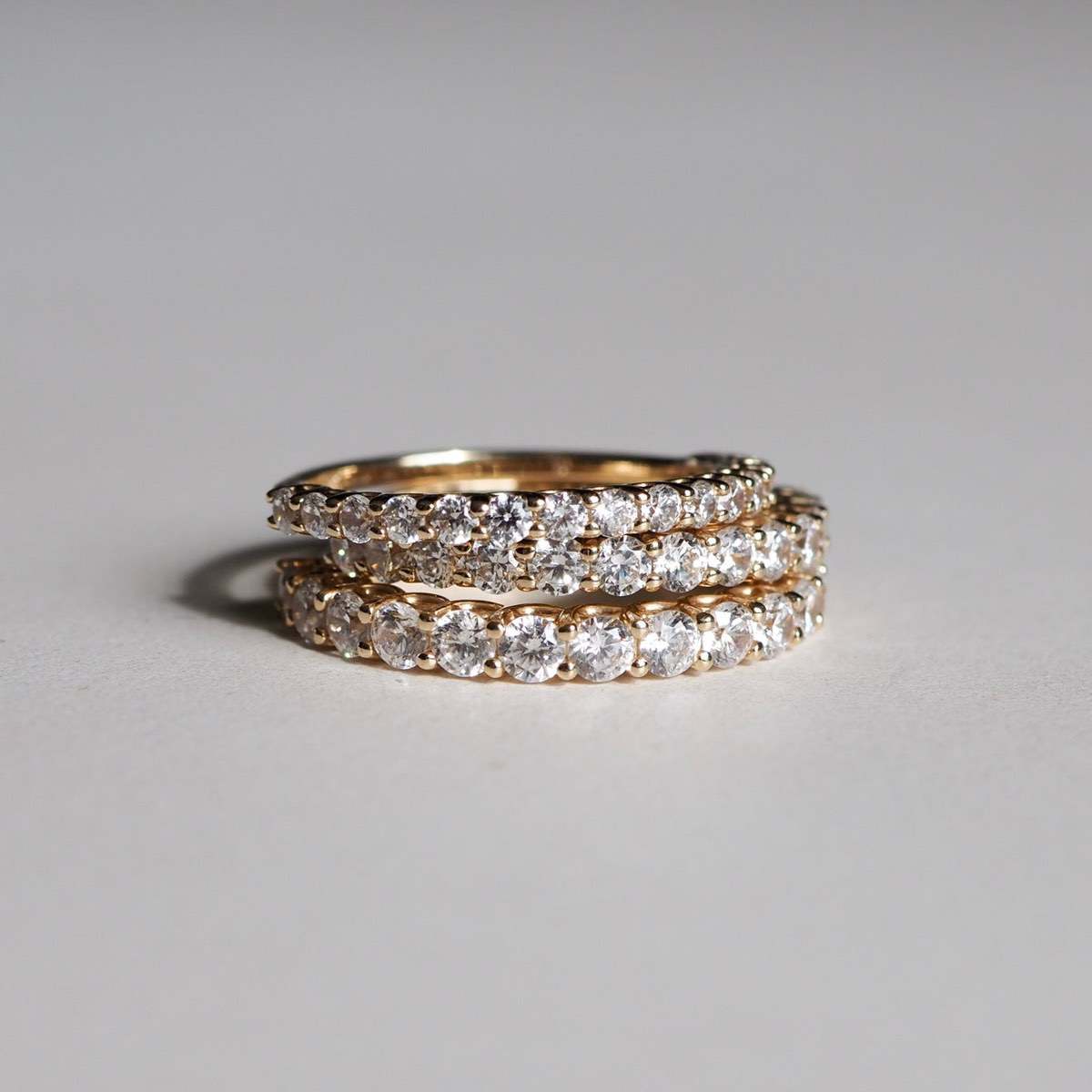 Stack of our Arraya diamond rings featuring our 2mm, 2.5mm and 3mm diamond bands