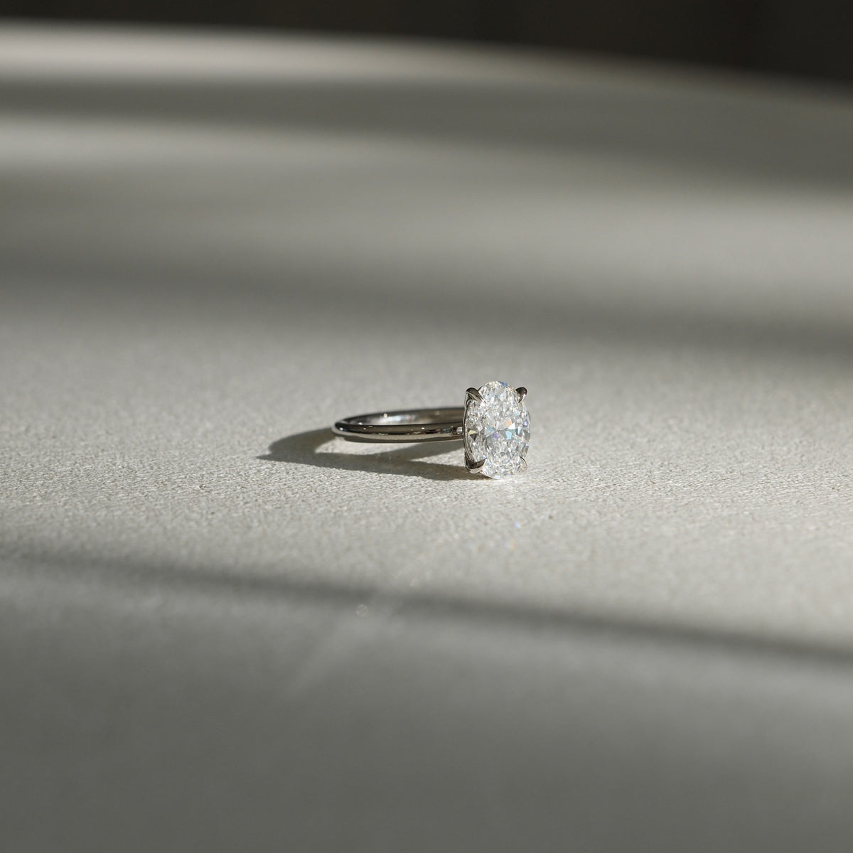 A perfectly refined Oval cut solitaire. Clara showcases the timeless beauty of a 1.65ct oval lab-grown diamond set in platinum. 