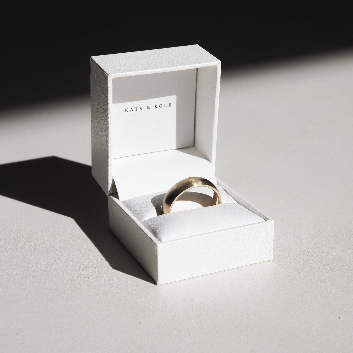Our classic half-round wide wedding band is 6mm wide and 1.9mm thick. It has a polished finish in 18ct yellow gold.