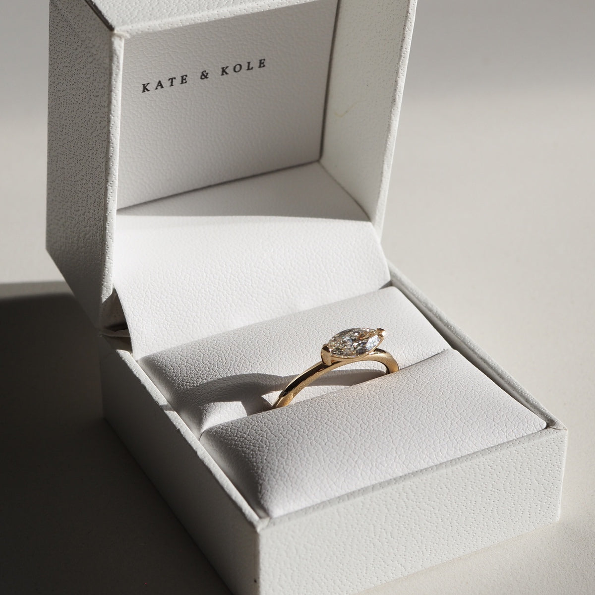 A contemporary east-west set marquise lab-grown diamond showcases the elongated facets of this stunning cut. Set in 18ct yellow gold on a round 1.8mm thick band.