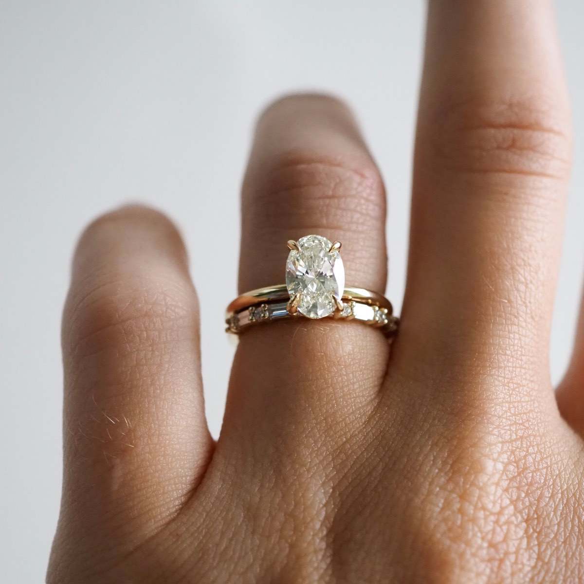 A seamless blend of claw set baguette & round brilliant cut lab-grown diamonds — created to pair perfectly alongside an engagement ring, or to be worn alone. Stone size 0.015ct each for round lab-grown diamonds and 0.04ct for baguette lab-grown diamonds. Featuring our Oval solitaire engagement ring, Clara.