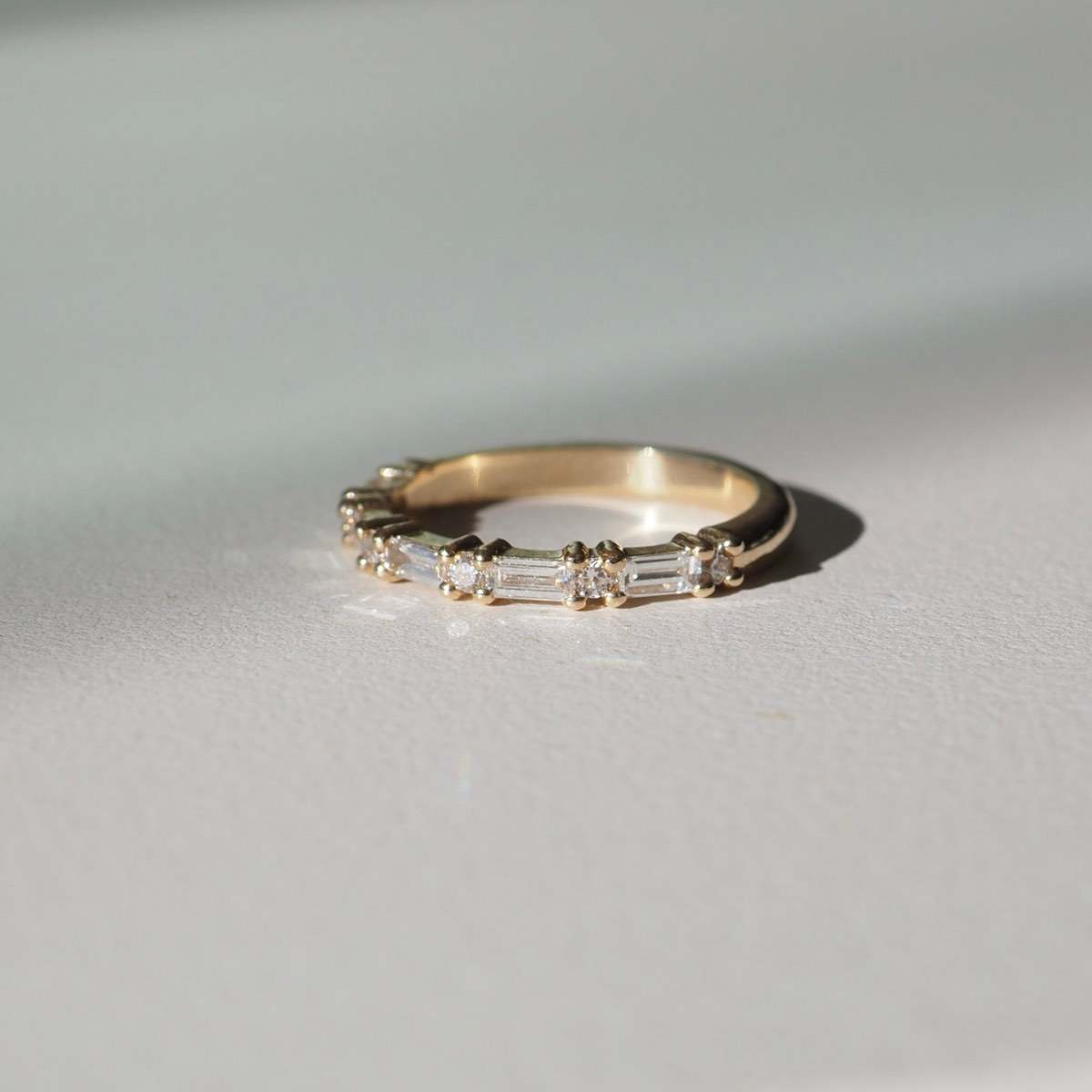 A seamless blend of claw set baguette & round brilliant cut lab-grown diamonds — created to pair perfectly alongside an engagement ring, or to be worn alone. Stone size 0.015ct each for round lab-grown diamonds and 0.04ct for baguette lab-grown diamonds.