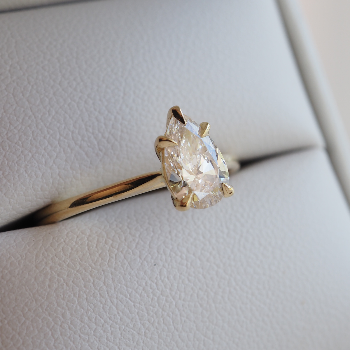 A romantically feminine Pear cut solitaire. Set in solid 18ct yellow gold featuring our 5 claw design. 