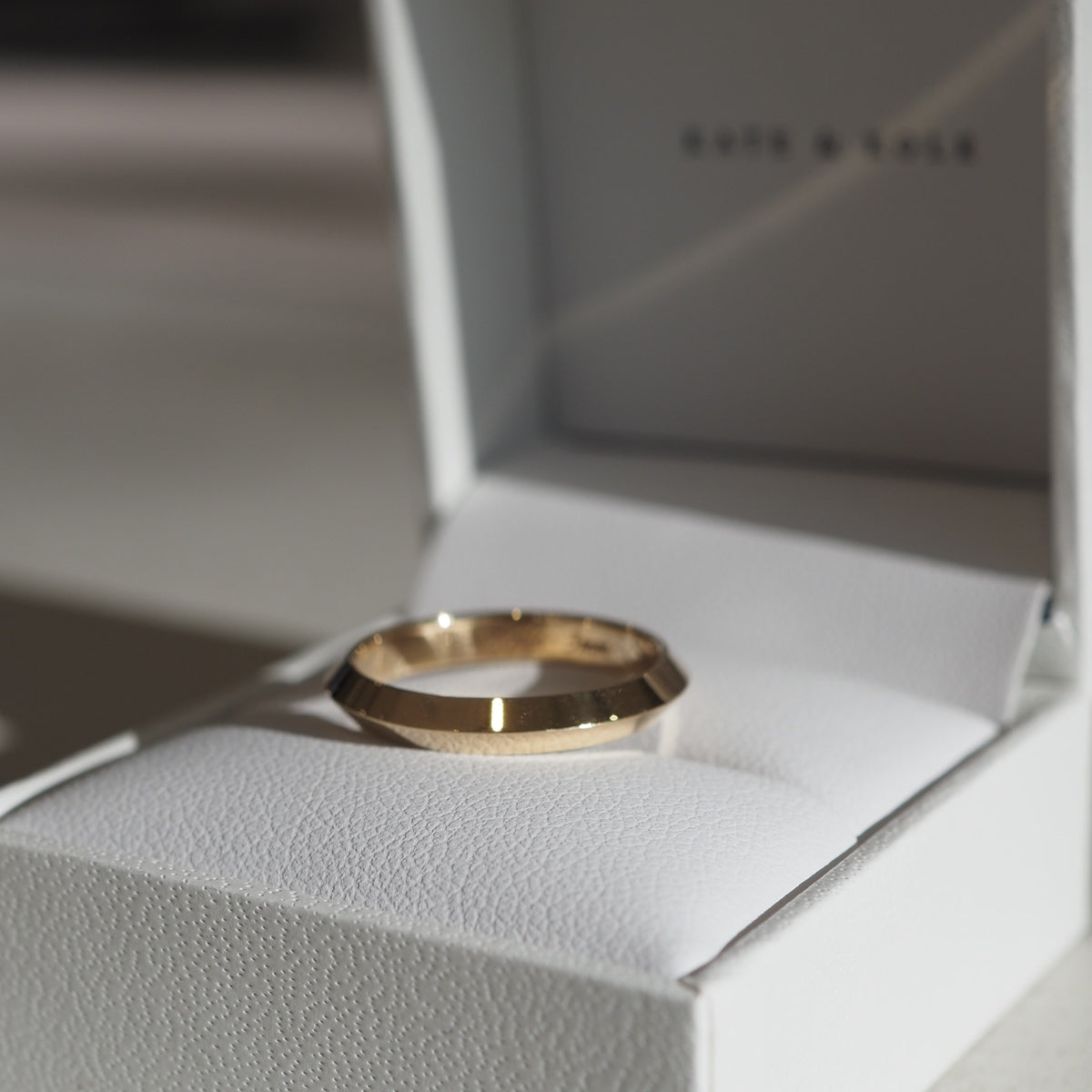 A simple gold band becomes the perfect knife edge ring. Add engraving to this piece to make it truly unique, 9ct yellow gold