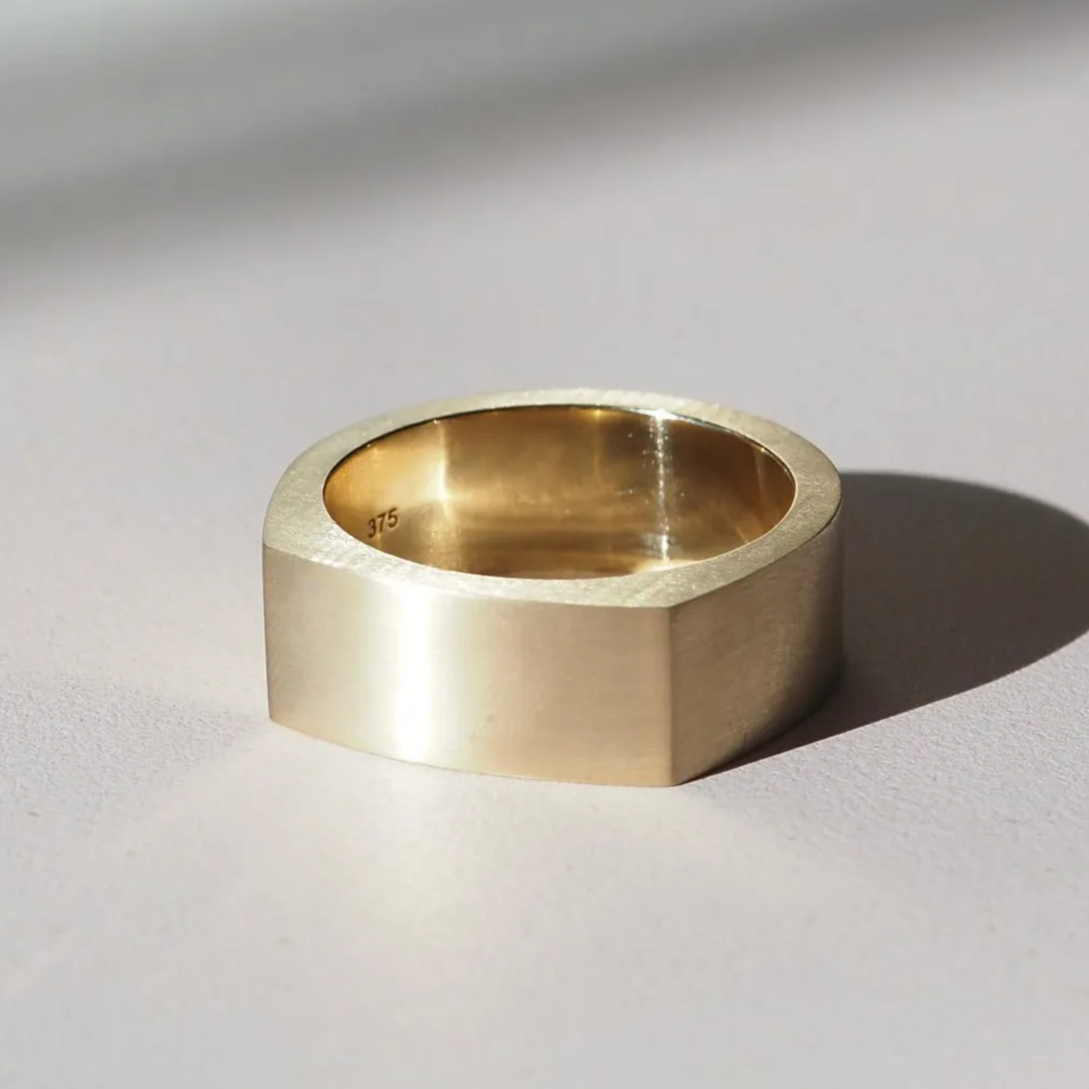 A modern flat top wedding band, designed for comfort and simplicity in 9ct yellow gold 