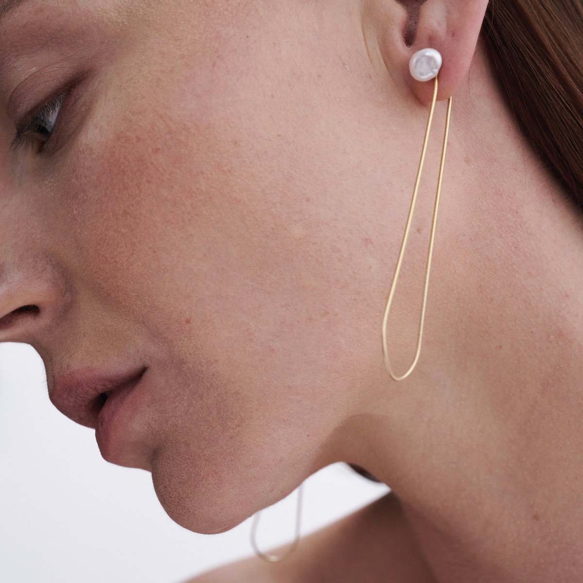 Model wears Natural Baroque Pearl Studs with Solid 9ct Yellow Gold Drops