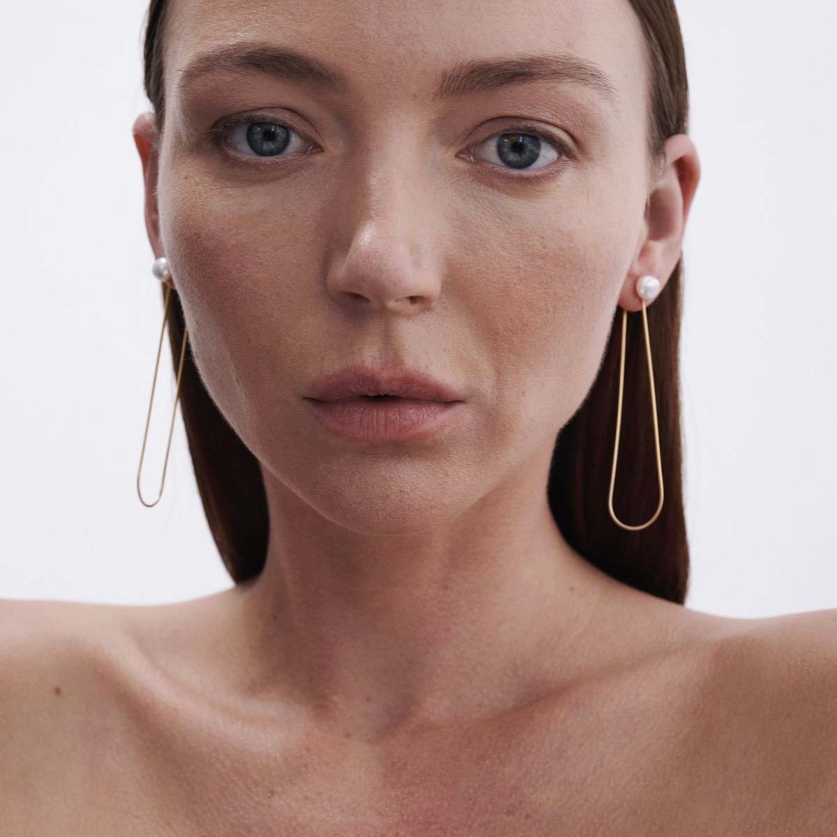 Model wears Natural Baroque Pearl Studs with Solid 9ct Yellow Gold Drops