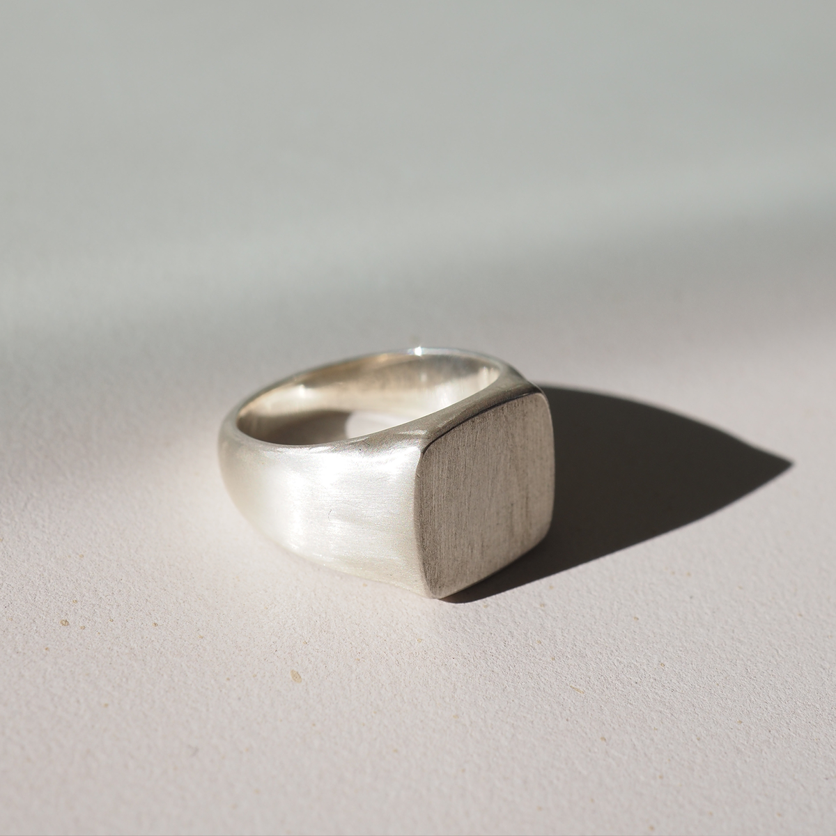 Based on a medium ring size, the face of our square signet measures 12mm square. The underside features a half round band measuring from a 3mm minimum width.