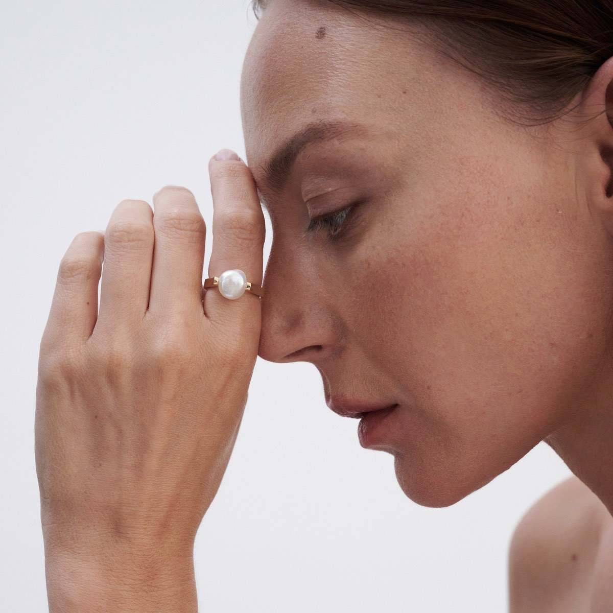 Model wears our stunning signature baroque pearl ring in 9ct yellow gold