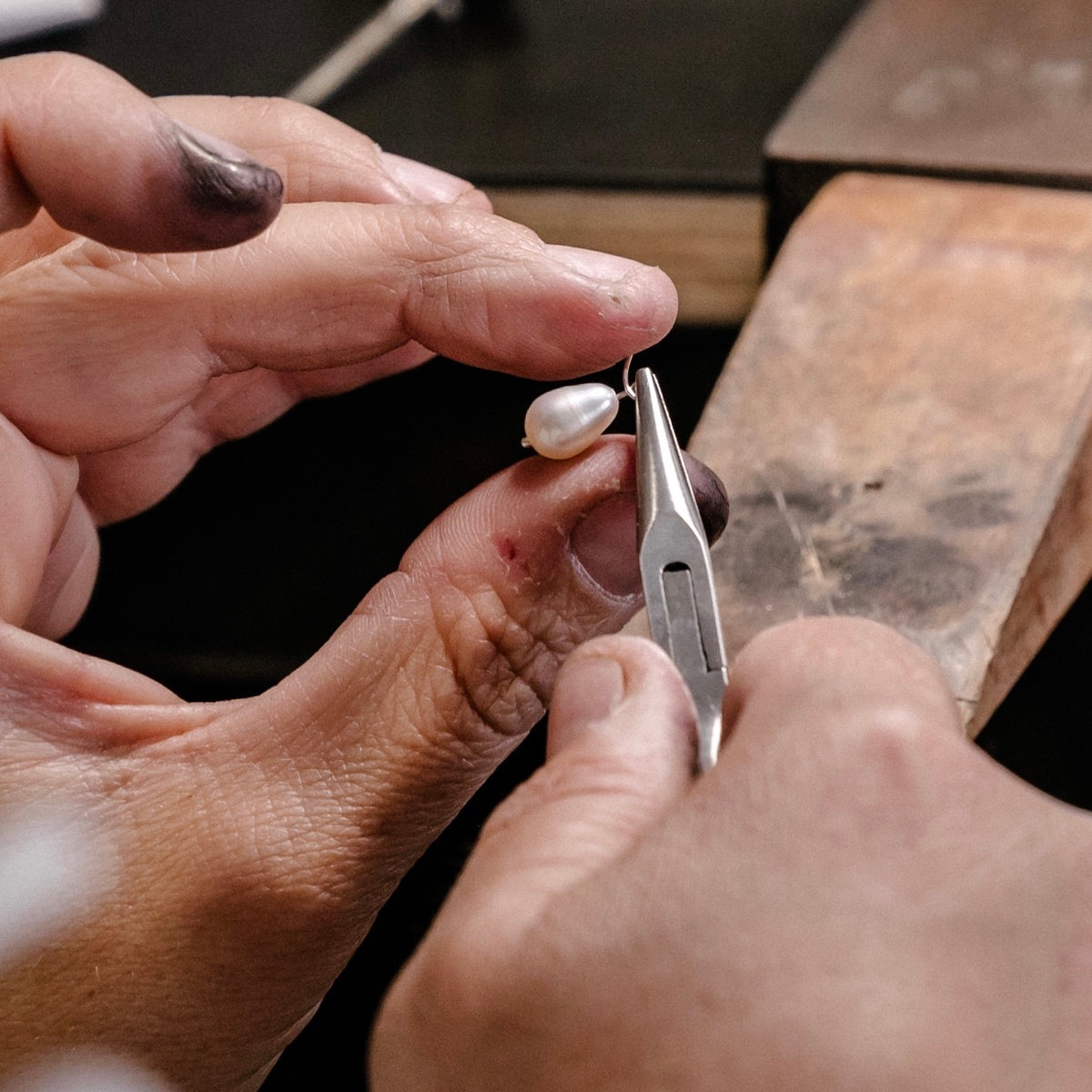 Our jewellers hand crafting our small baroque pearl earrings in sterling silver in our Newcastle Studio