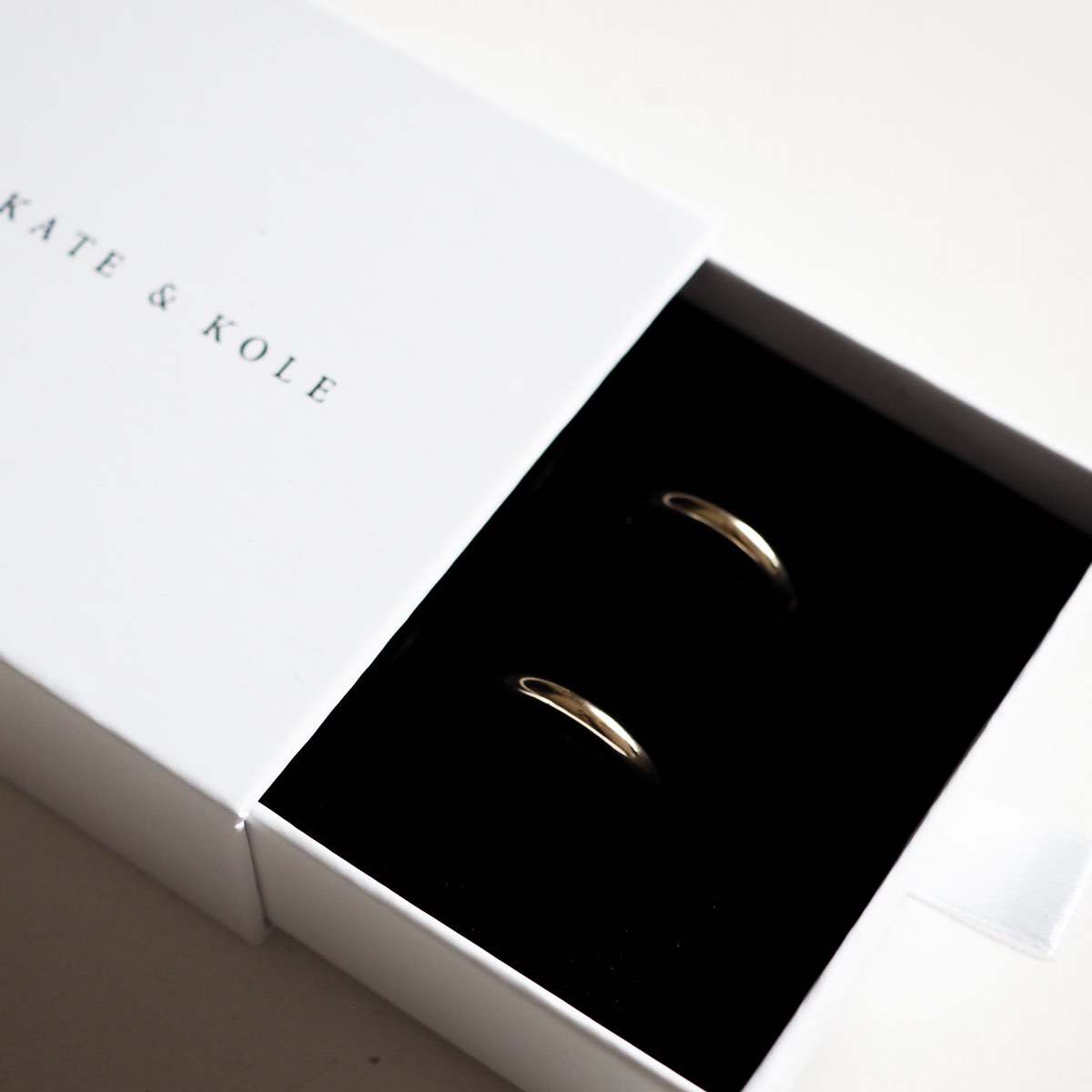 Our solid 9ct yellow gold small round huggies sitting perfectly in our Kate & Kole jewellery box