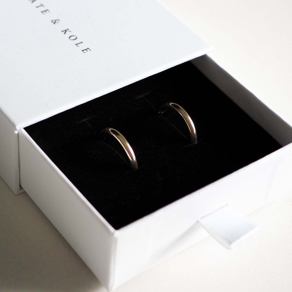 Our solid 9ct yellow gold small round huggies sitting perfectly in our Kate & Kole jewellery box