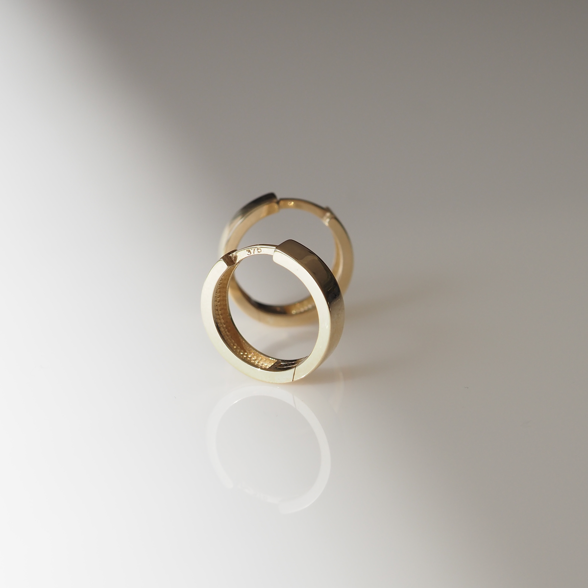 Solid Gold Huggies: Small 10mm hoop earrings made for everyday wear