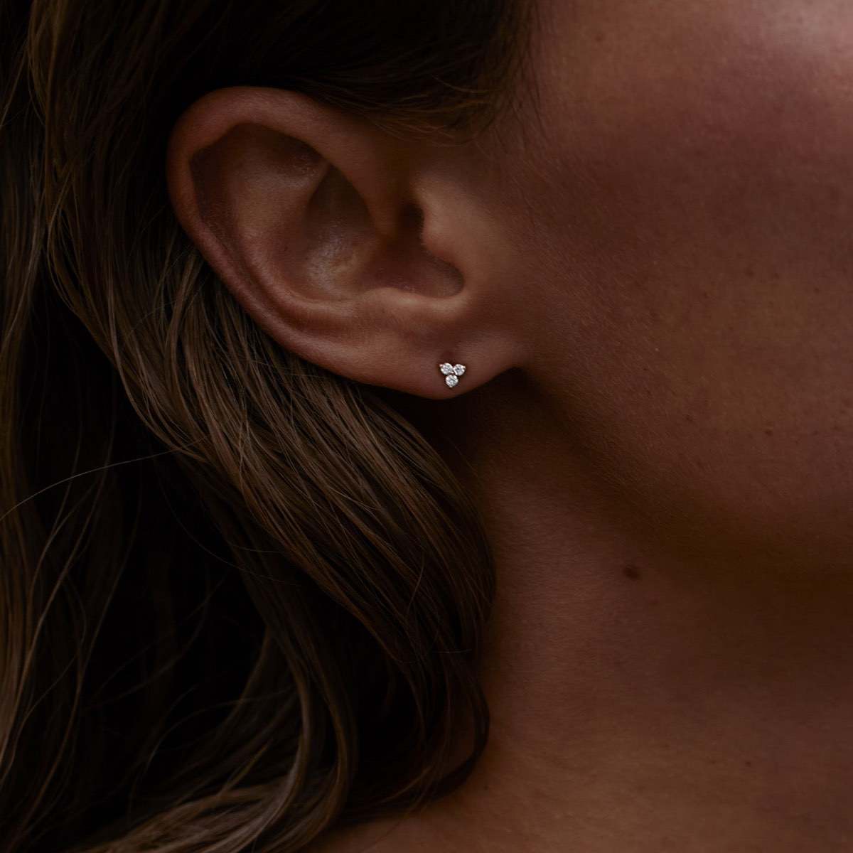 Model wears 9ct Yellow Gold Therefore Stud Earrings made for everyday wear.
