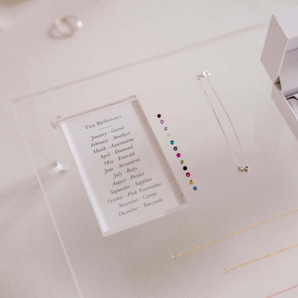 A selection of our 12 birthstones to personalise our Tiny Birthstone Charm Bracelet