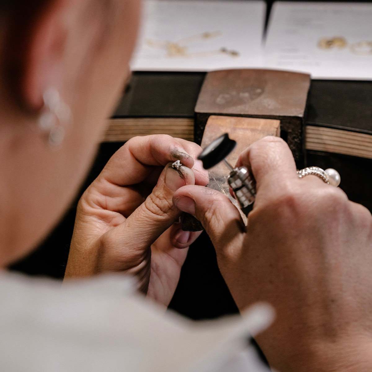 Solid Gold and Silver Jewellery: Our jewellers hand-finishing high quality necklace charms in studio