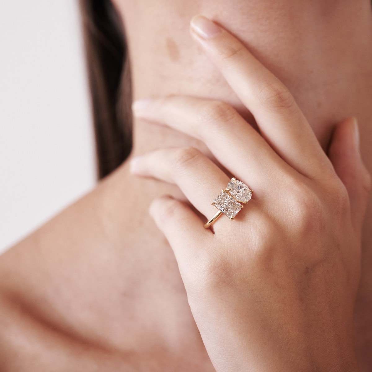 Oval and radiant lab-grown diamonds are paired side by side to represent two souls meeting as one.  Set in solid 18ct yellow gold with a 1.8mm round band profile. The stones pictures are a 2ct oval and 2.05ct radiant lab-grown diamond. 