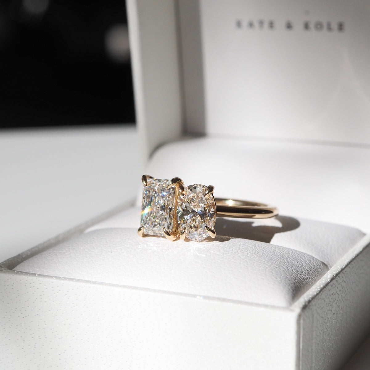 Oval and radiant lab-grown diamonds are paired side by side to represent two souls meeting as one.  Set in solid 18ct yellow gold with a 1.8mm round band profile. The stones pictures are a 2ct oval and 2.05ct radiant lab-grown diamond.