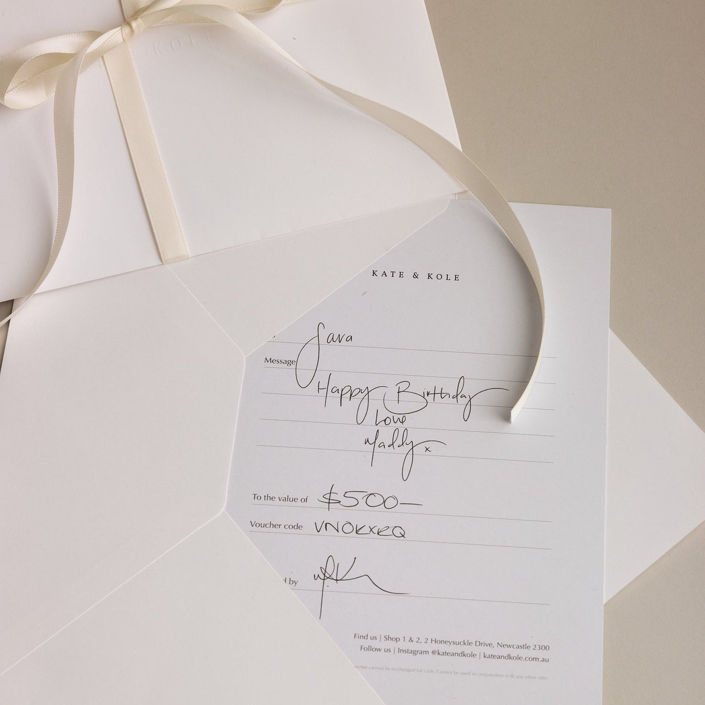 Beautifully written Kate & Kole gift card on a cream background