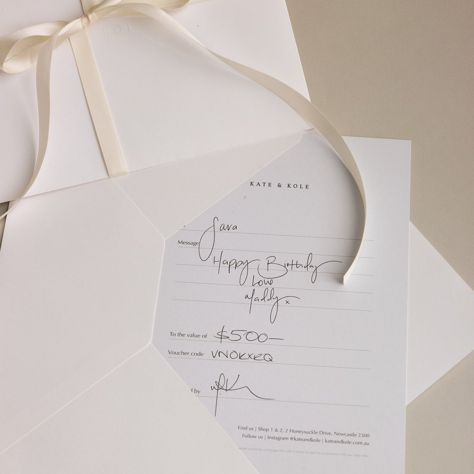 Beautifully written Kate & Kole gift card on a cream background