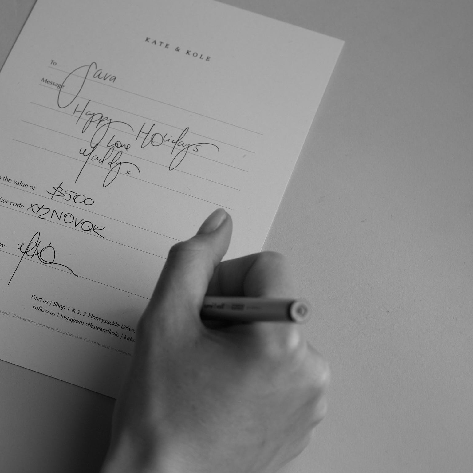 A black and white image of a beautifully written Kate & Kole gift card