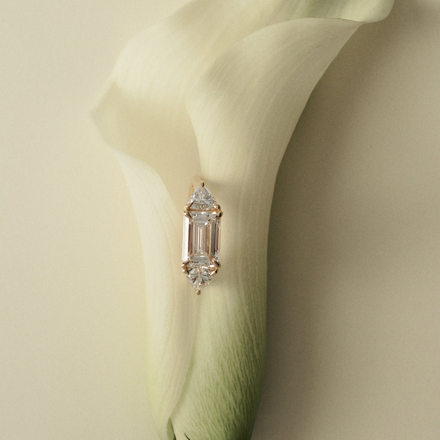 Diamond ring on a white flower petal