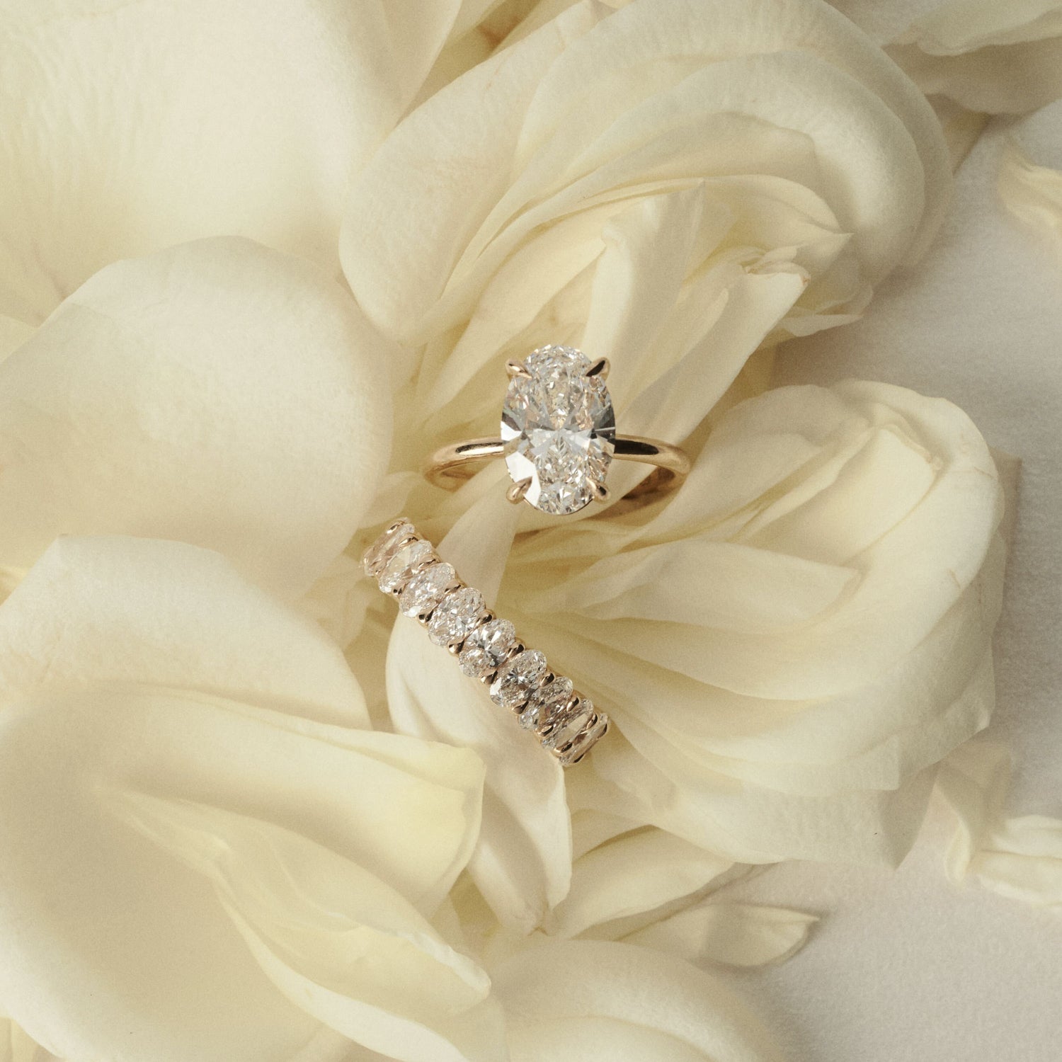 Diamond ring on a bed of white roses