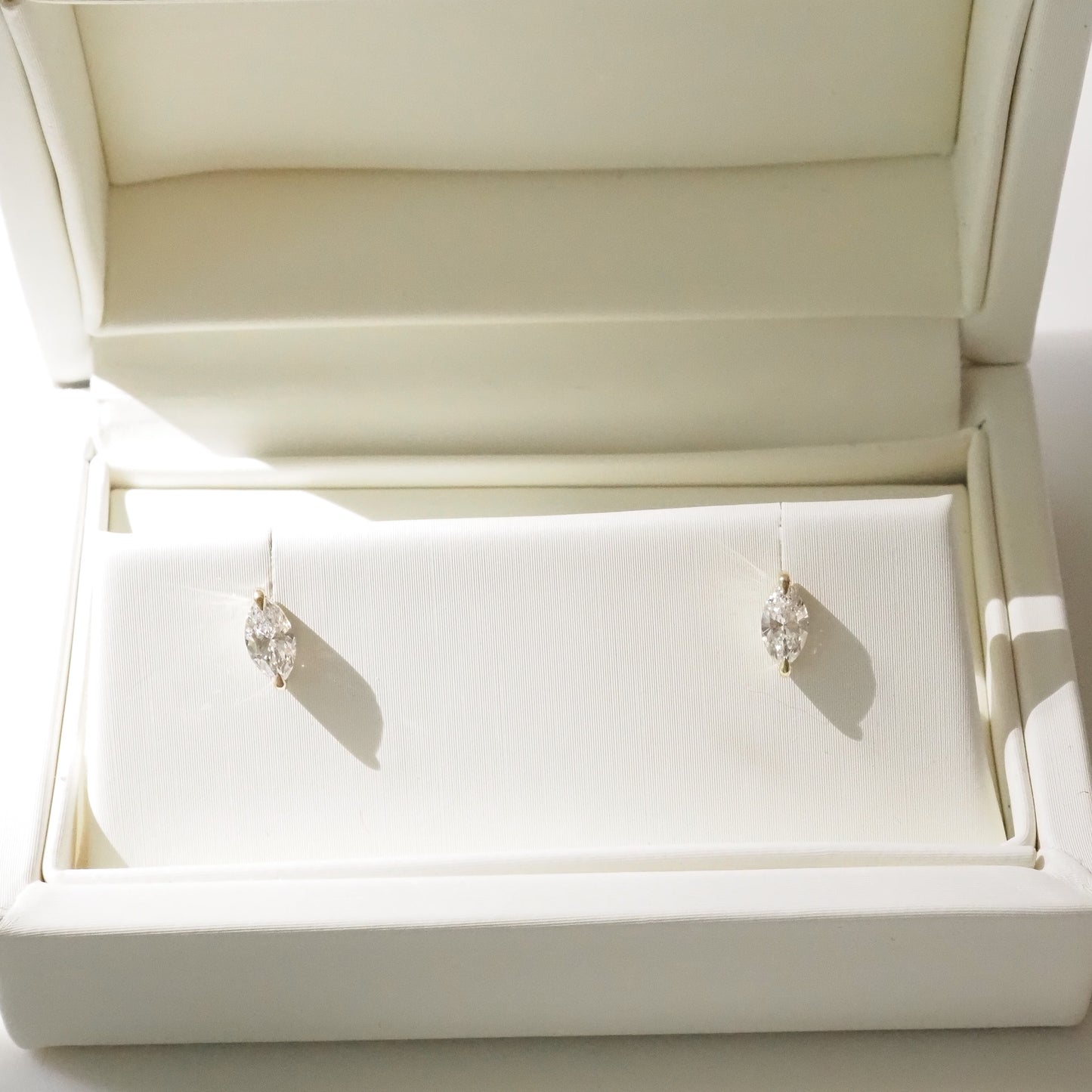 Pair of marquise earrings in a white jewelry box