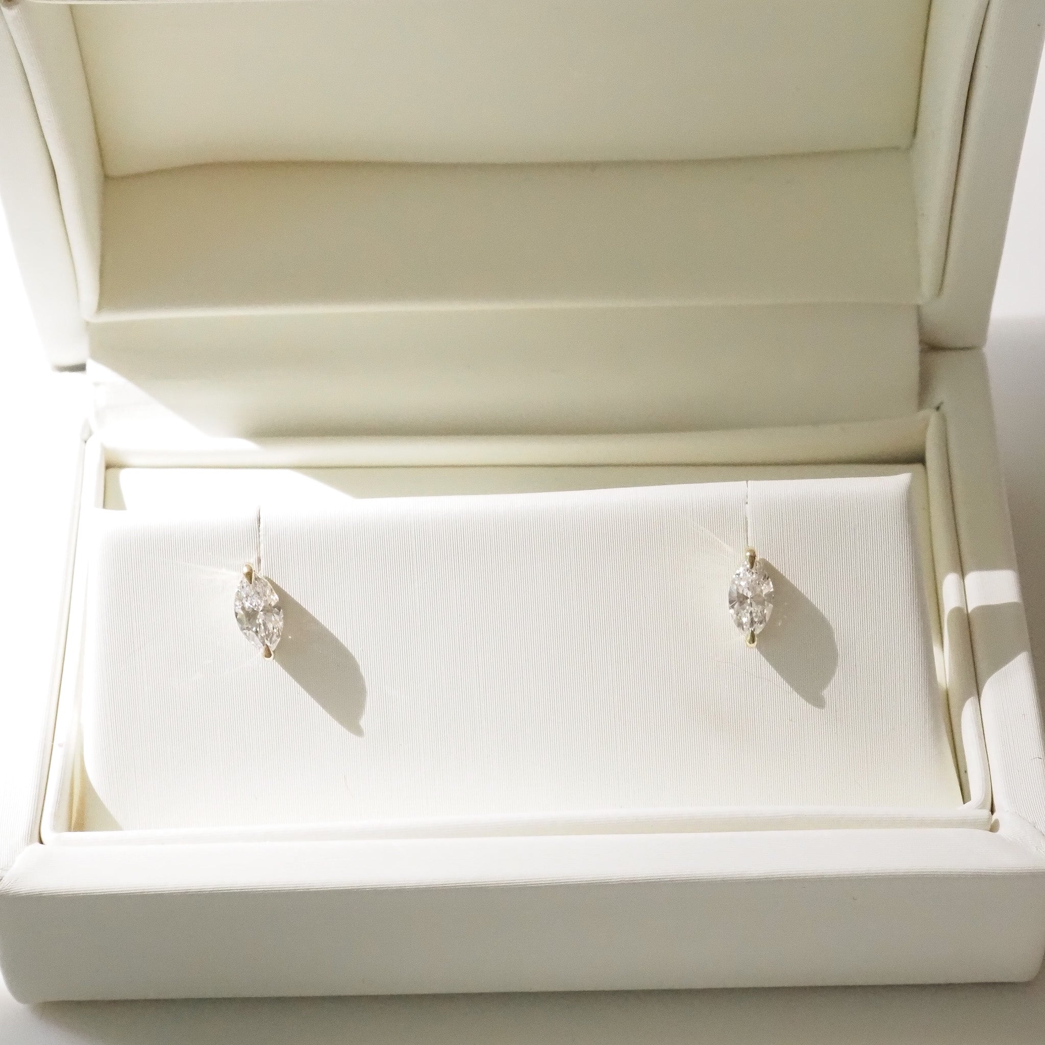 Pair of marquise earrings in a white jewelry box