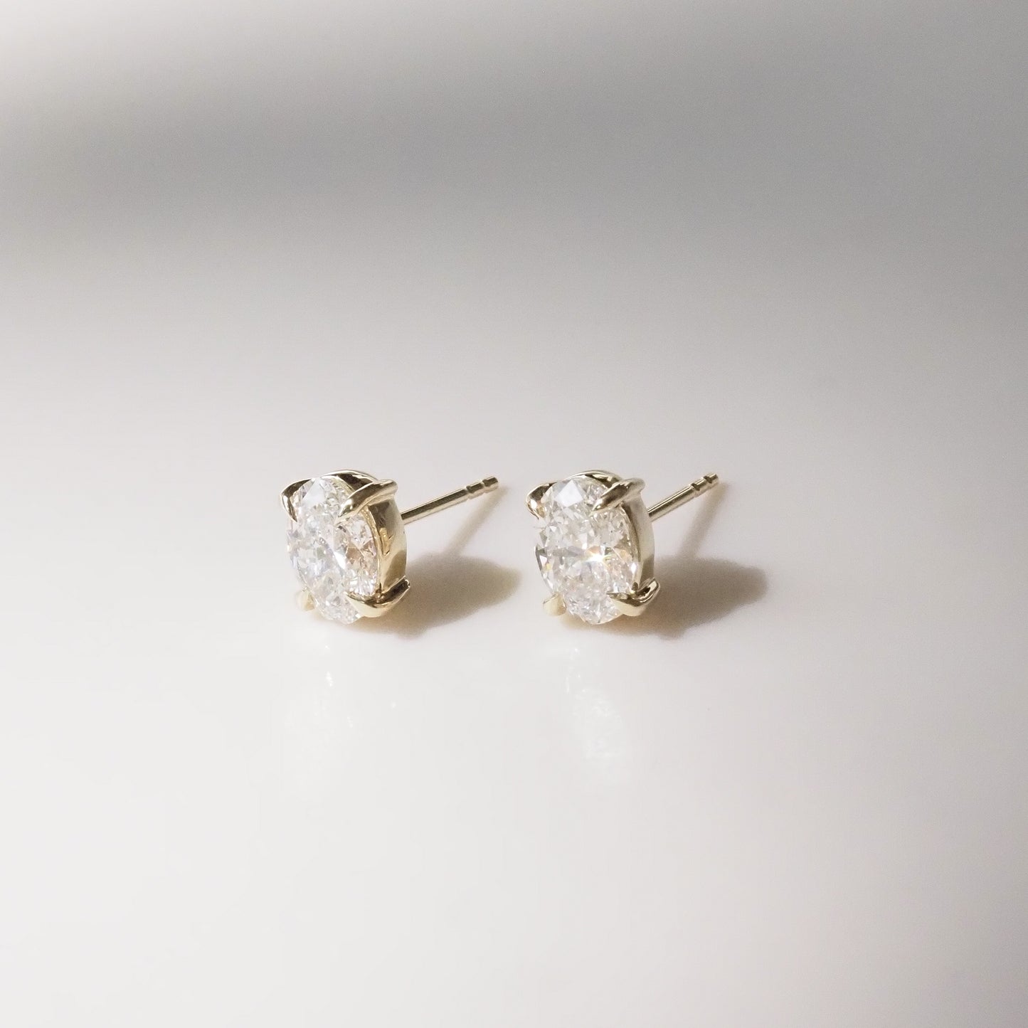 Oval Diamond studs on a white background