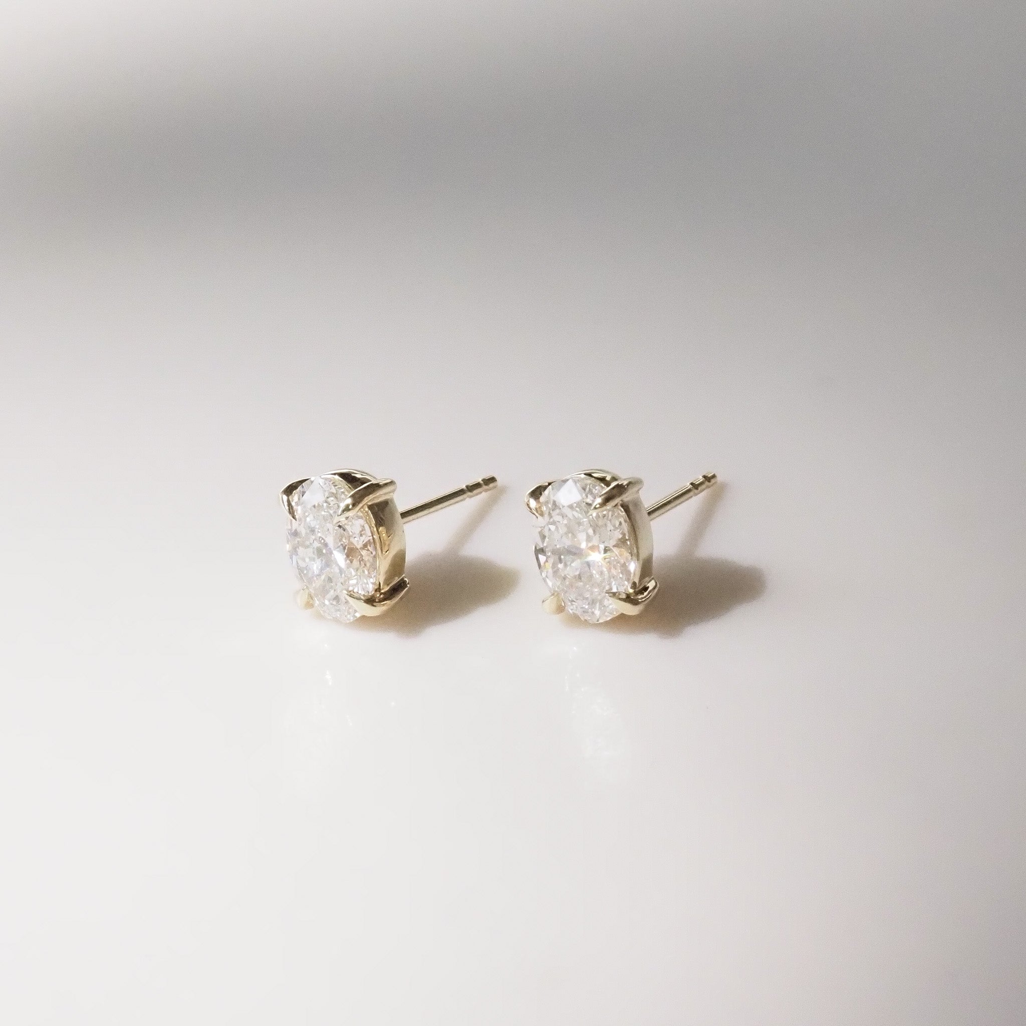 Oval Diamond studs on a white background