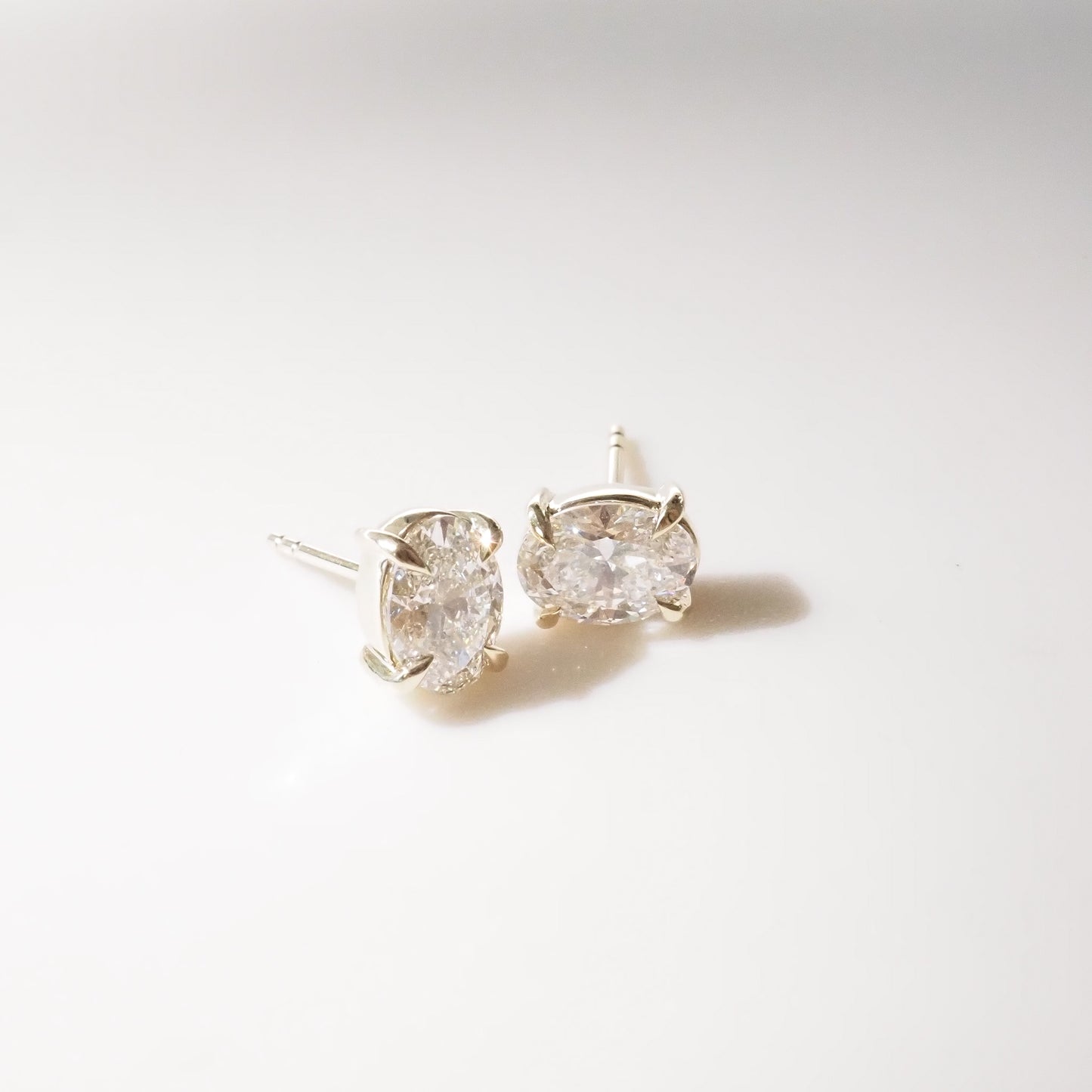 Oval Diamond studs on a white background