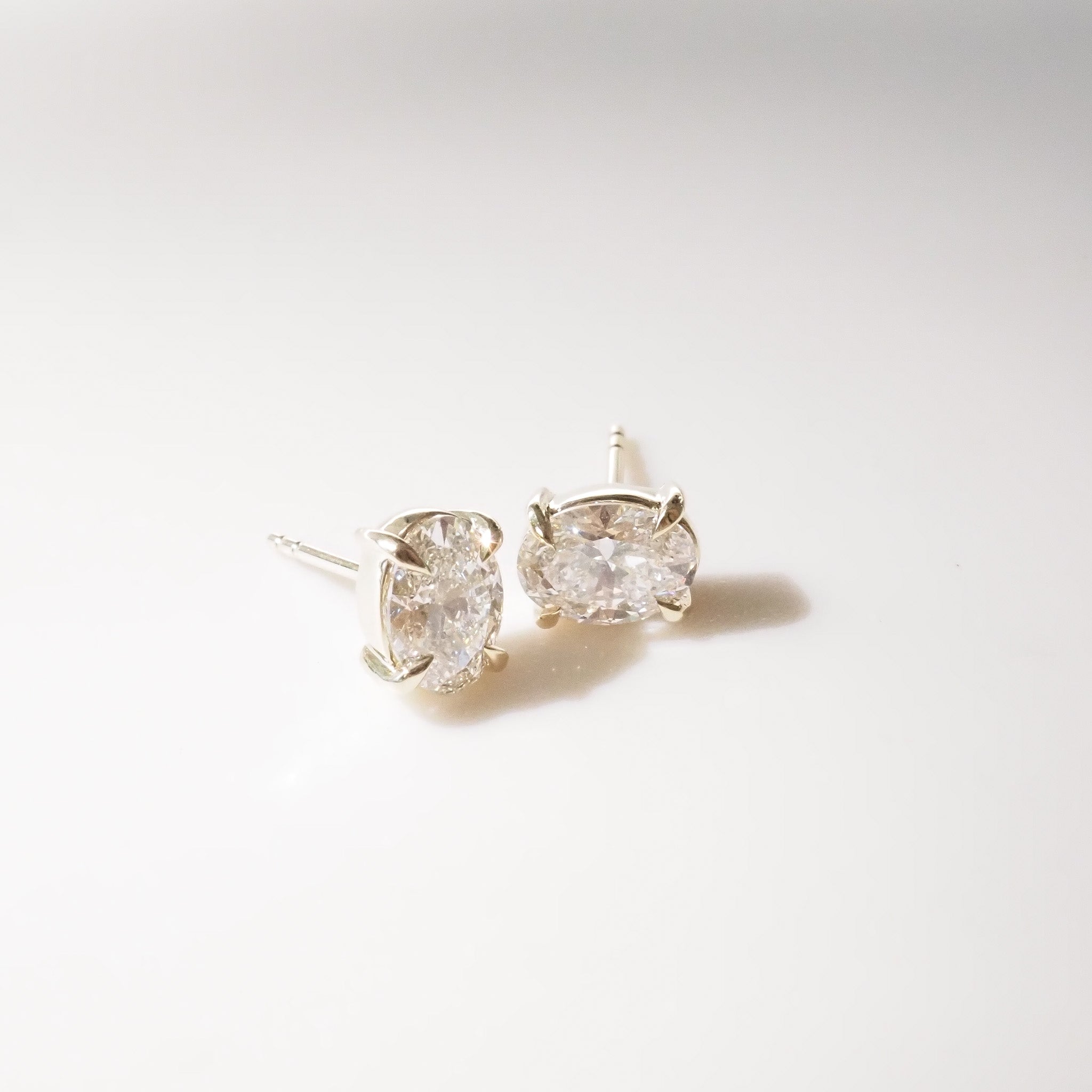 Oval Diamond studs on a white background