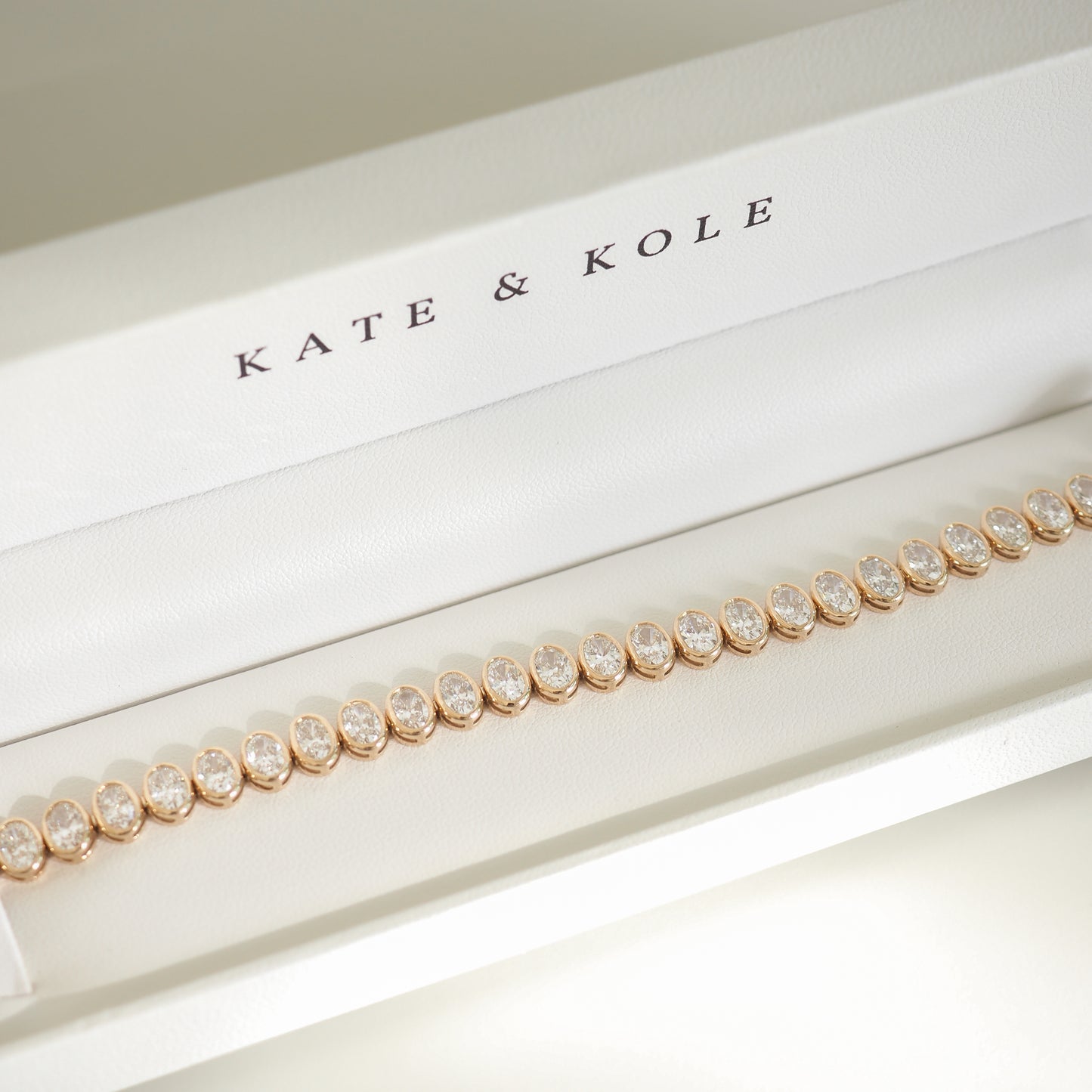 Elegant diamond bracelet in a white Kate & Kole box, showcasing luxury jewellery with sparkling gemstones set in a refined design.