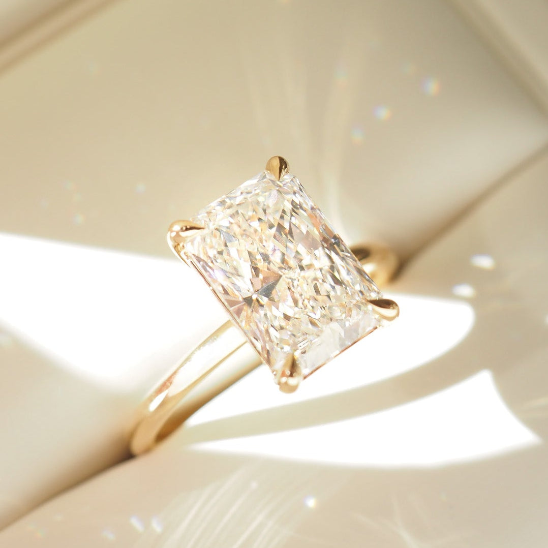 Gold ring with a diamond in a jewelry box