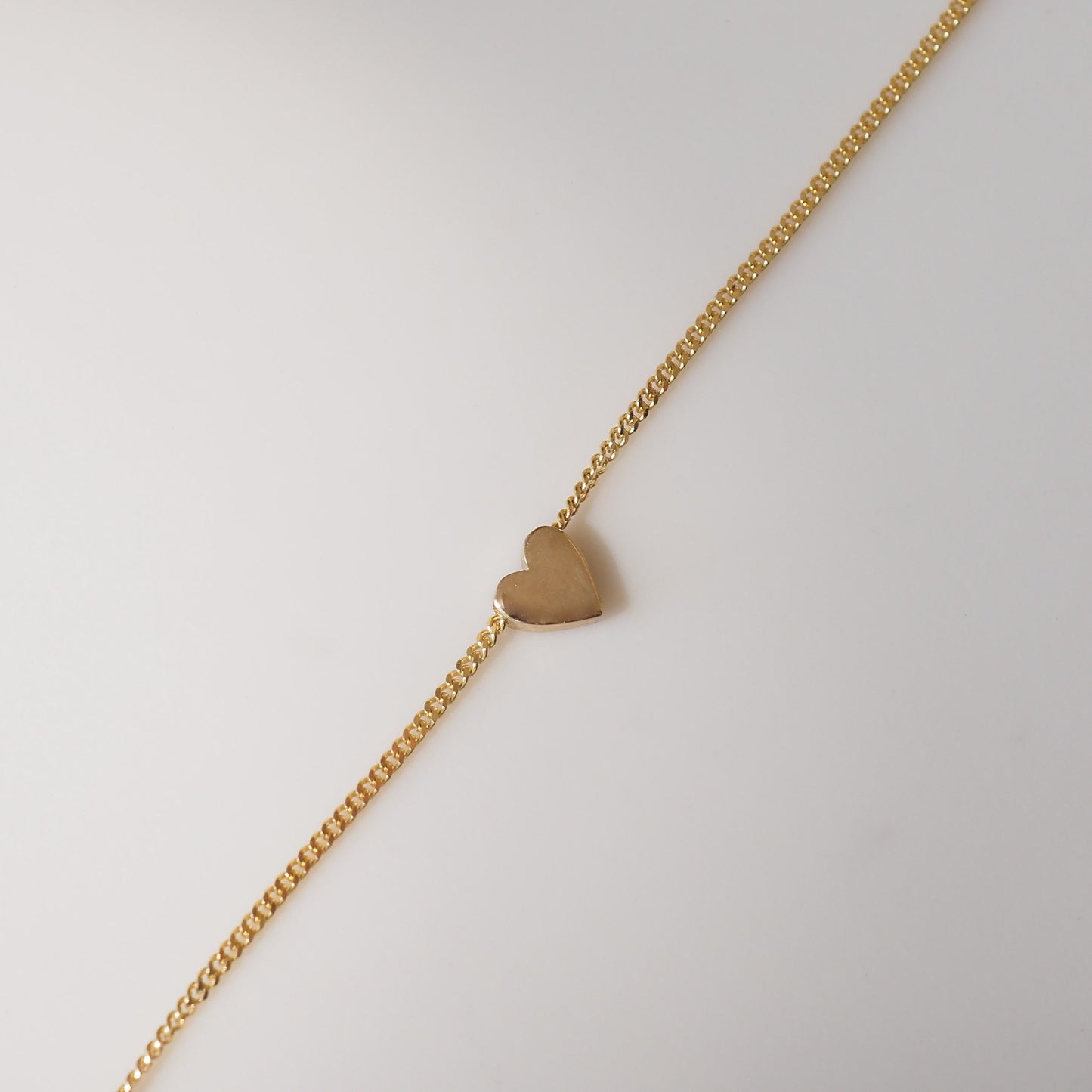 Small heart charm on chain