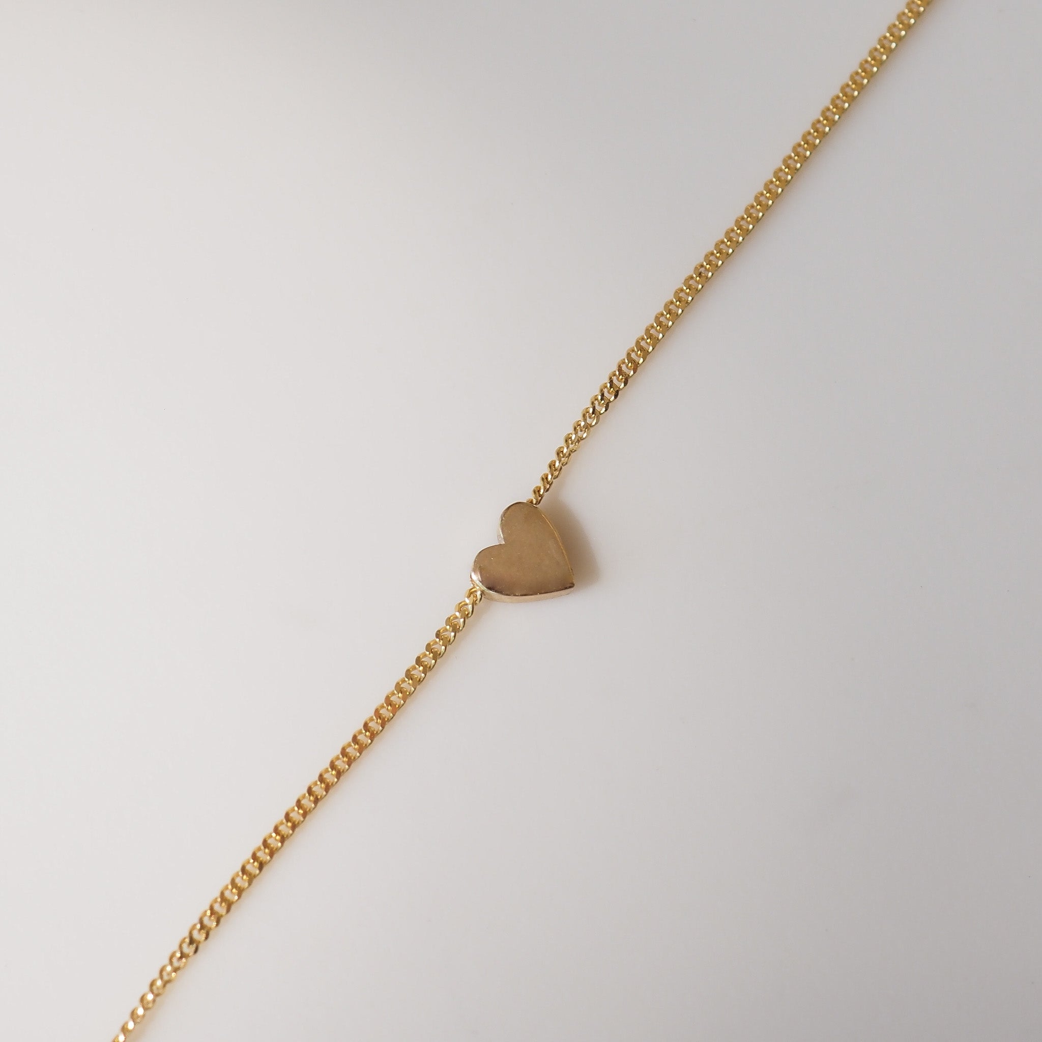 Small heart charm on chain