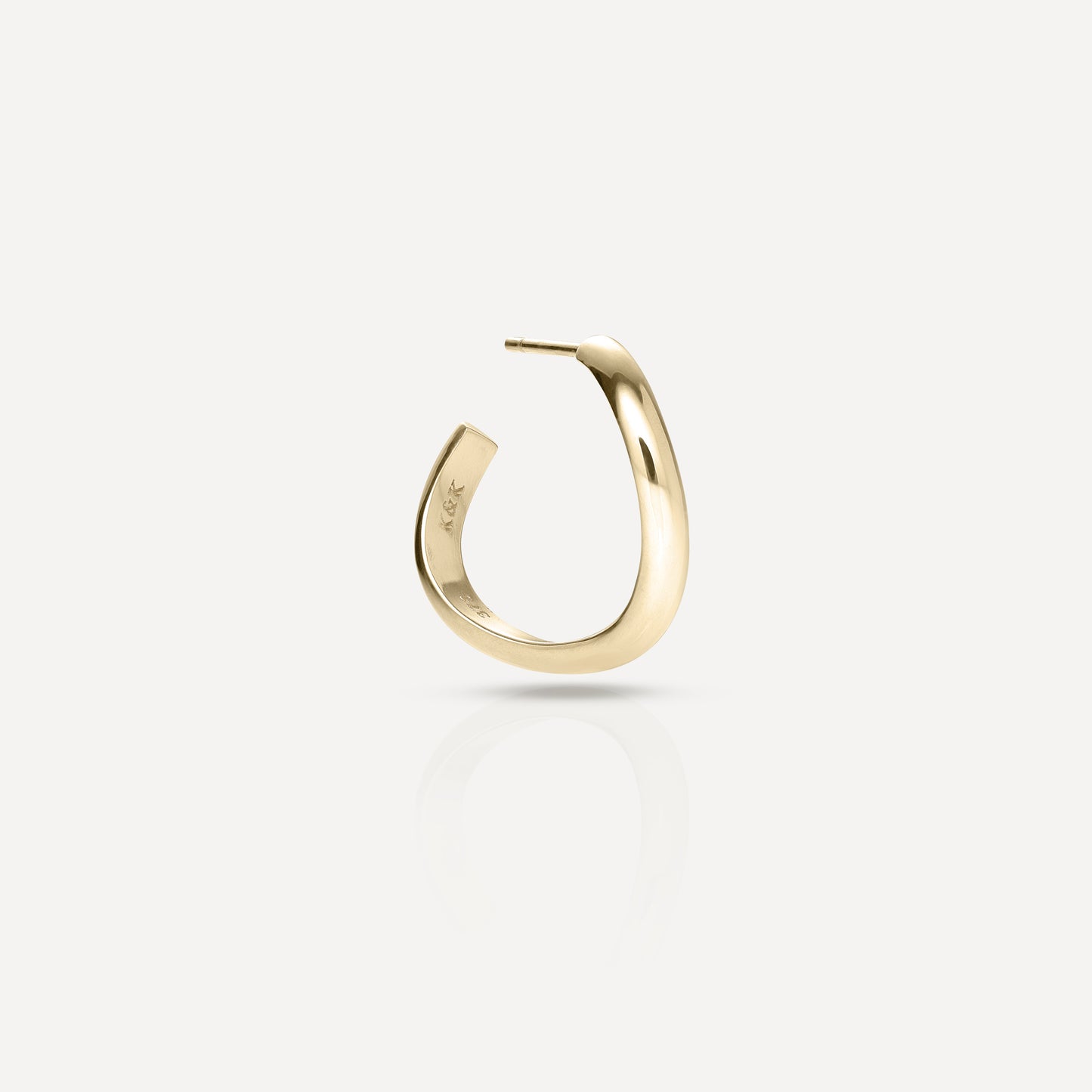 Minimalist gold hoop earring, elegantly curved, set against a light background. Perfect for luxury jewellery enthusiasts.